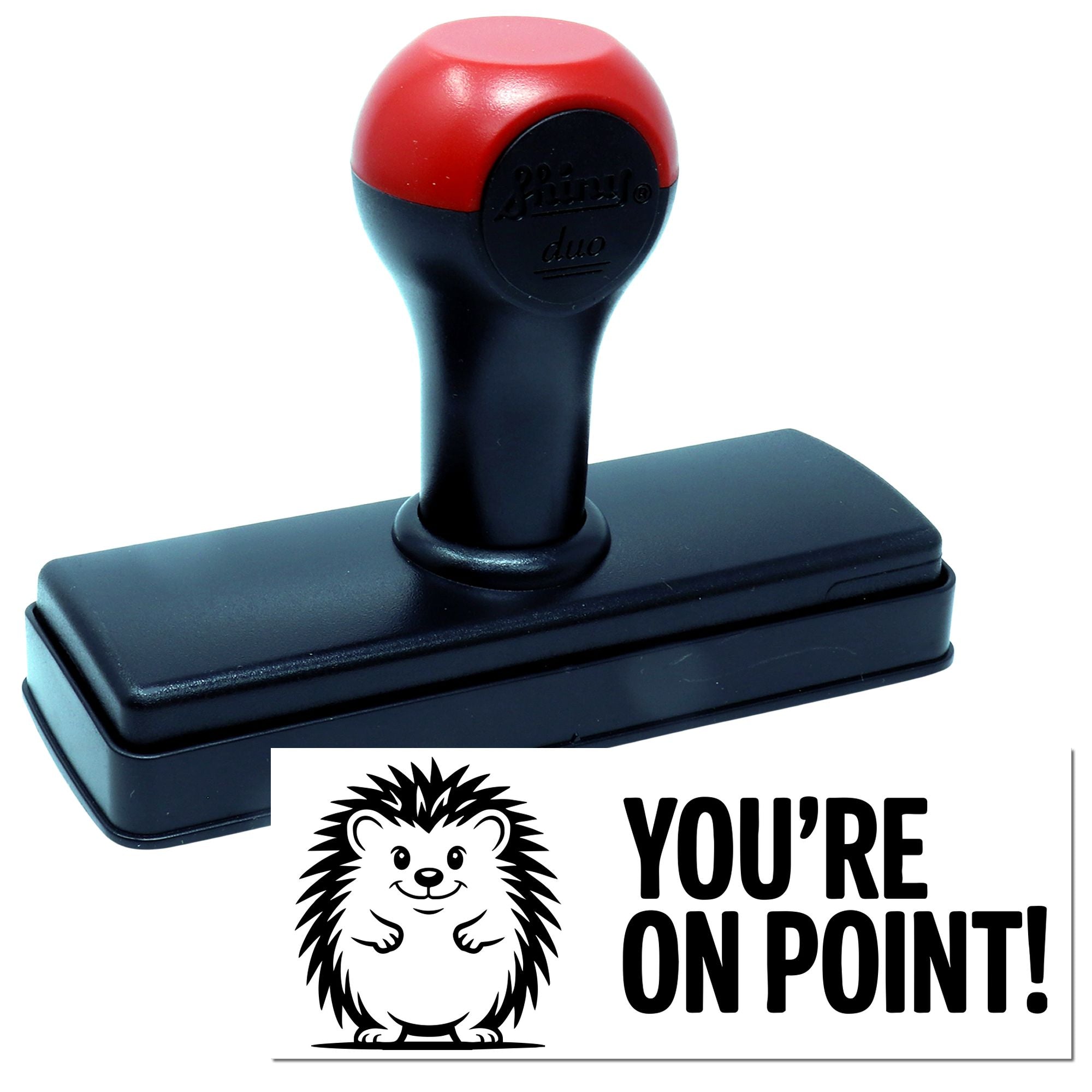Red and black self-inking stamp with black base, beside a hedgehog seal reading YOURE ON POINT!