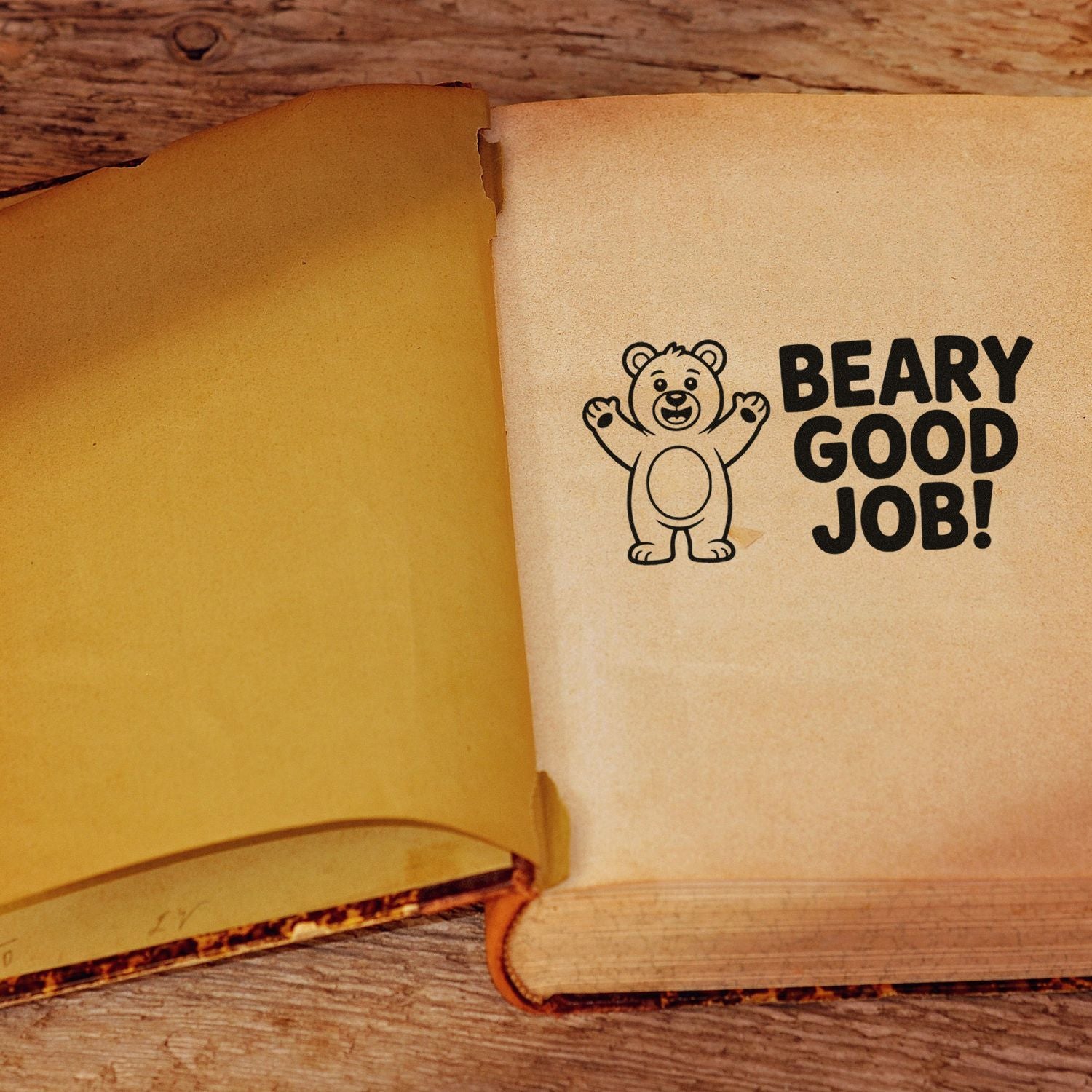 Wooden stamp seal on tan paper, featuring a black bear and BEARY GOOD JOB! text on a rustic wood background.