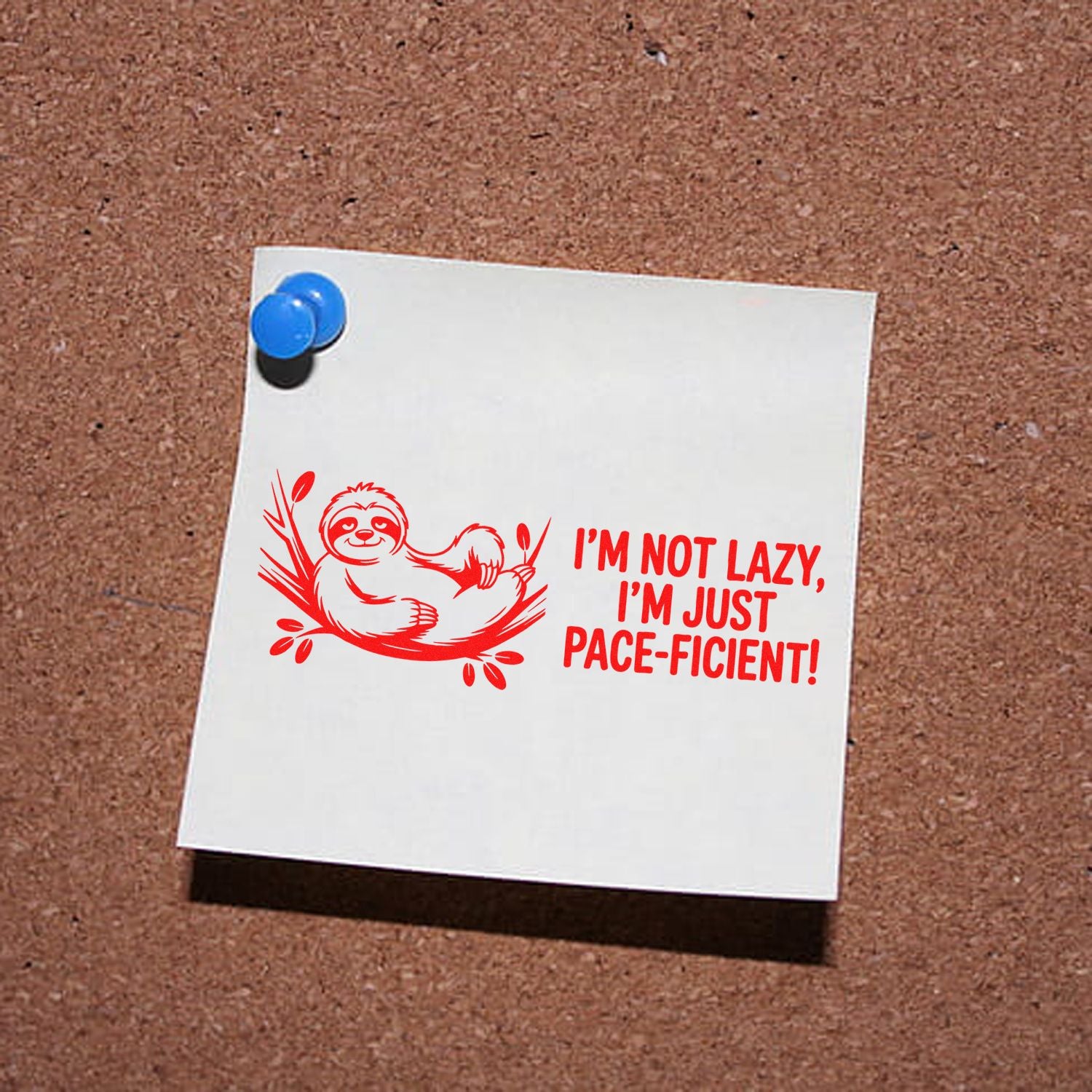 Red rubber stamp design with a sloth and Im just pace-ficient text on a white note pinned with blue pushpins.