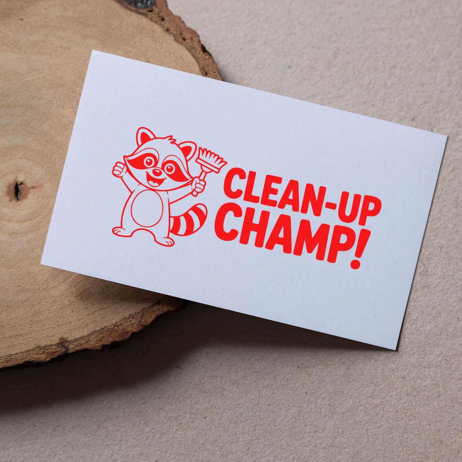 Red stamp and seal design with raccoon mascot holding a brush and CLEAN-UP CHAMP! on a white card.