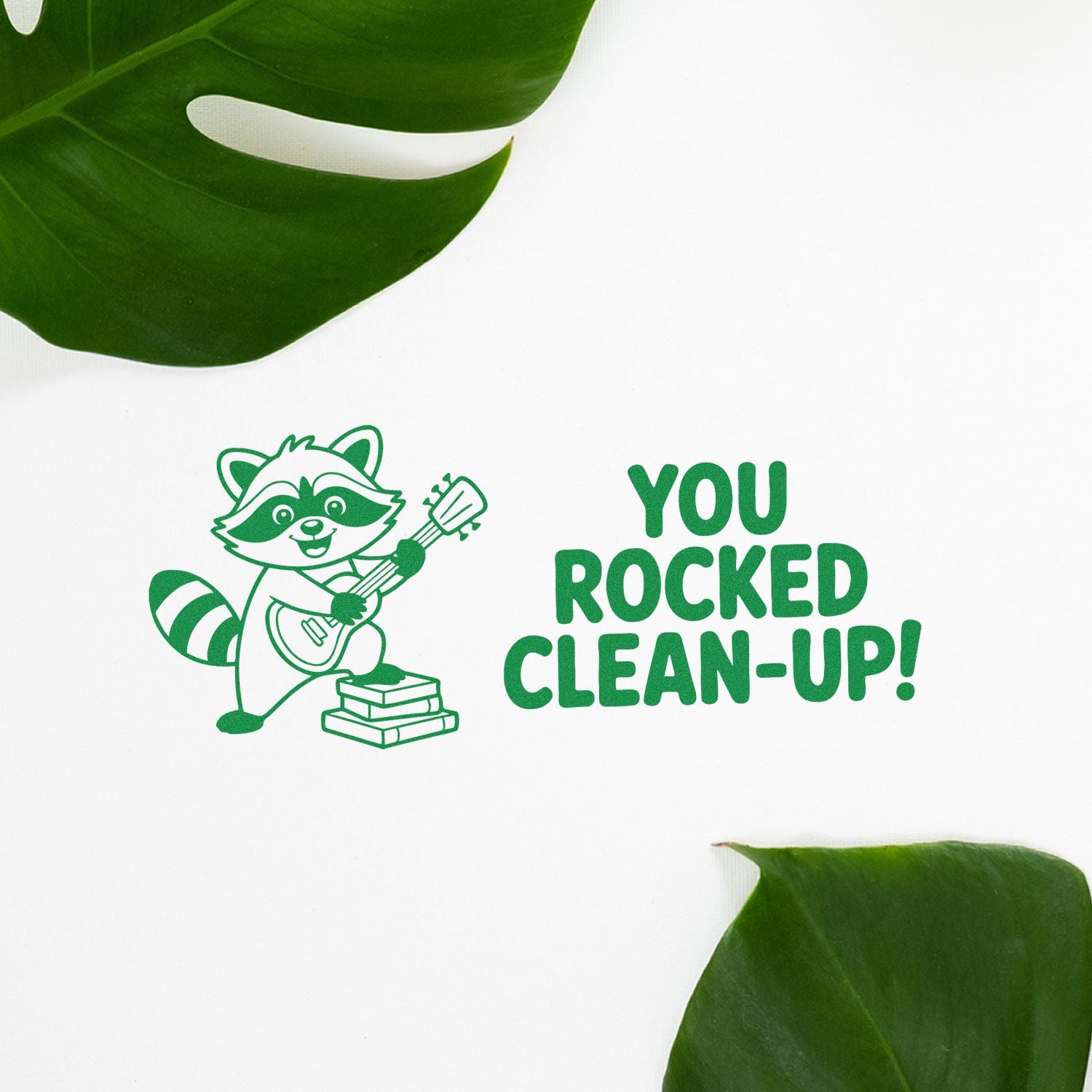 Green stamp-and-seal design with raccoon holding a guitar and You Rocked Clean-Up! text on white, framed by leaves.