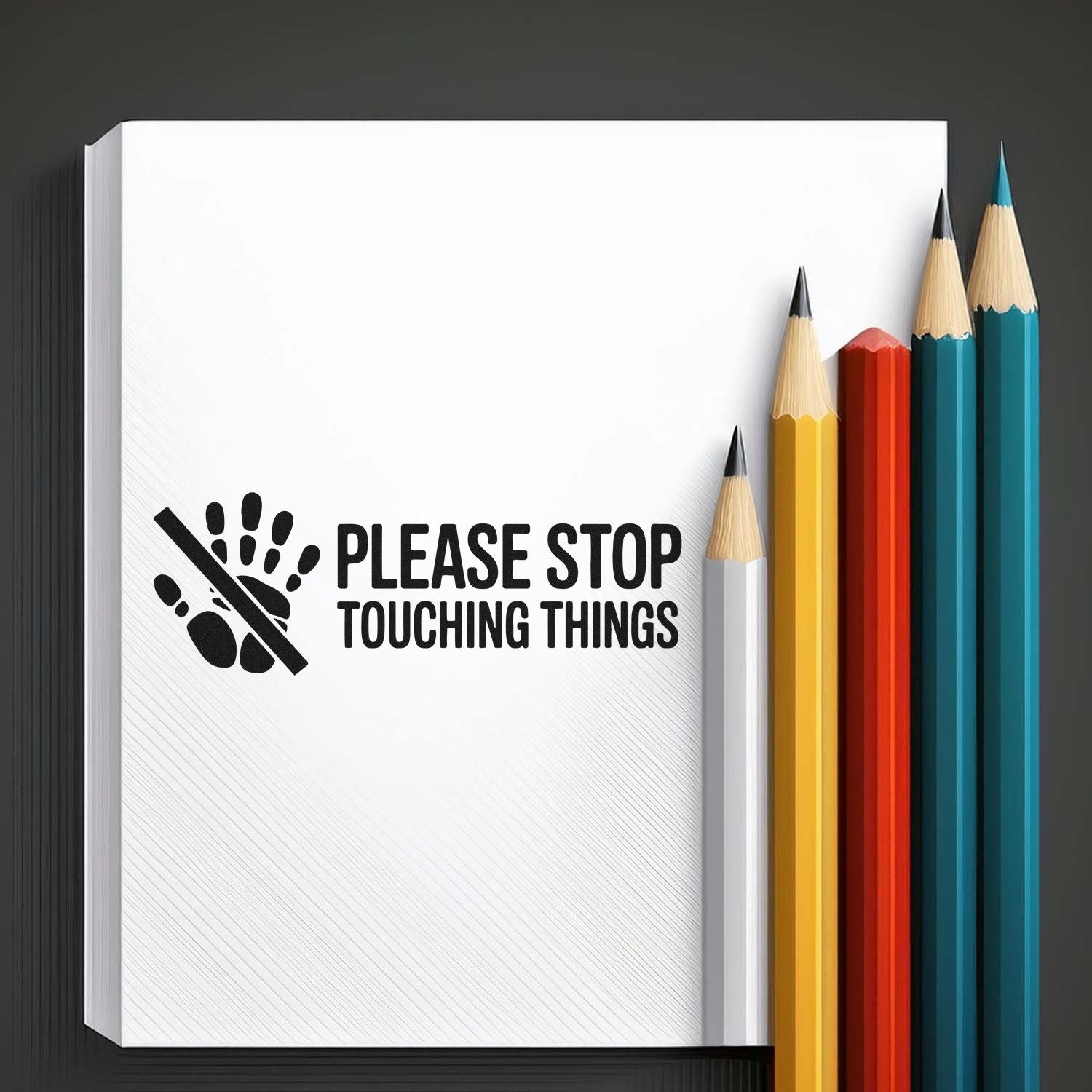 Custom stamp and seal: black Please Stop Touching Things design on white page with colorful pencils.