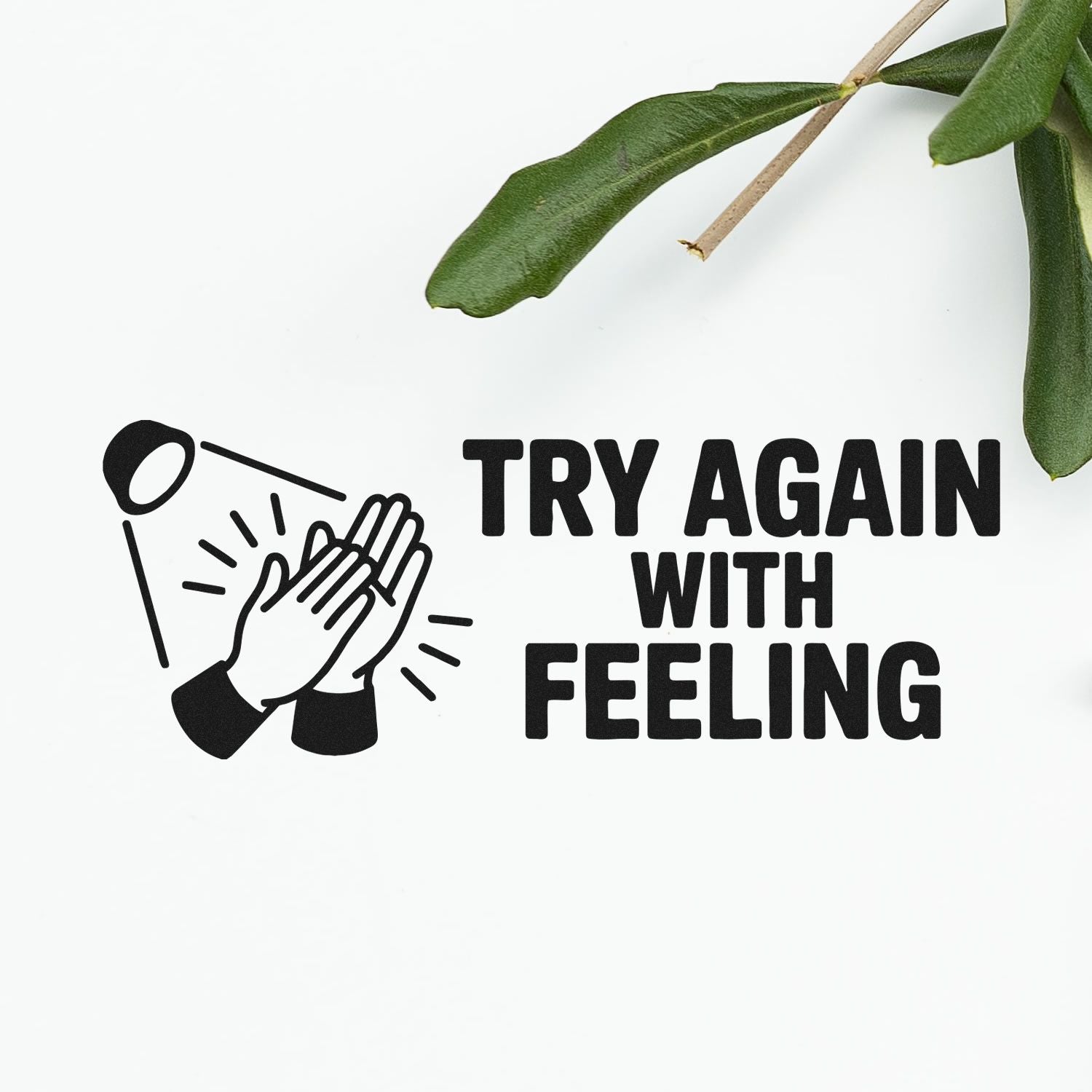 Black stamp and seal with clapping hands icon and TRY AGAIN WITH FEELING text on white, with green leaves.