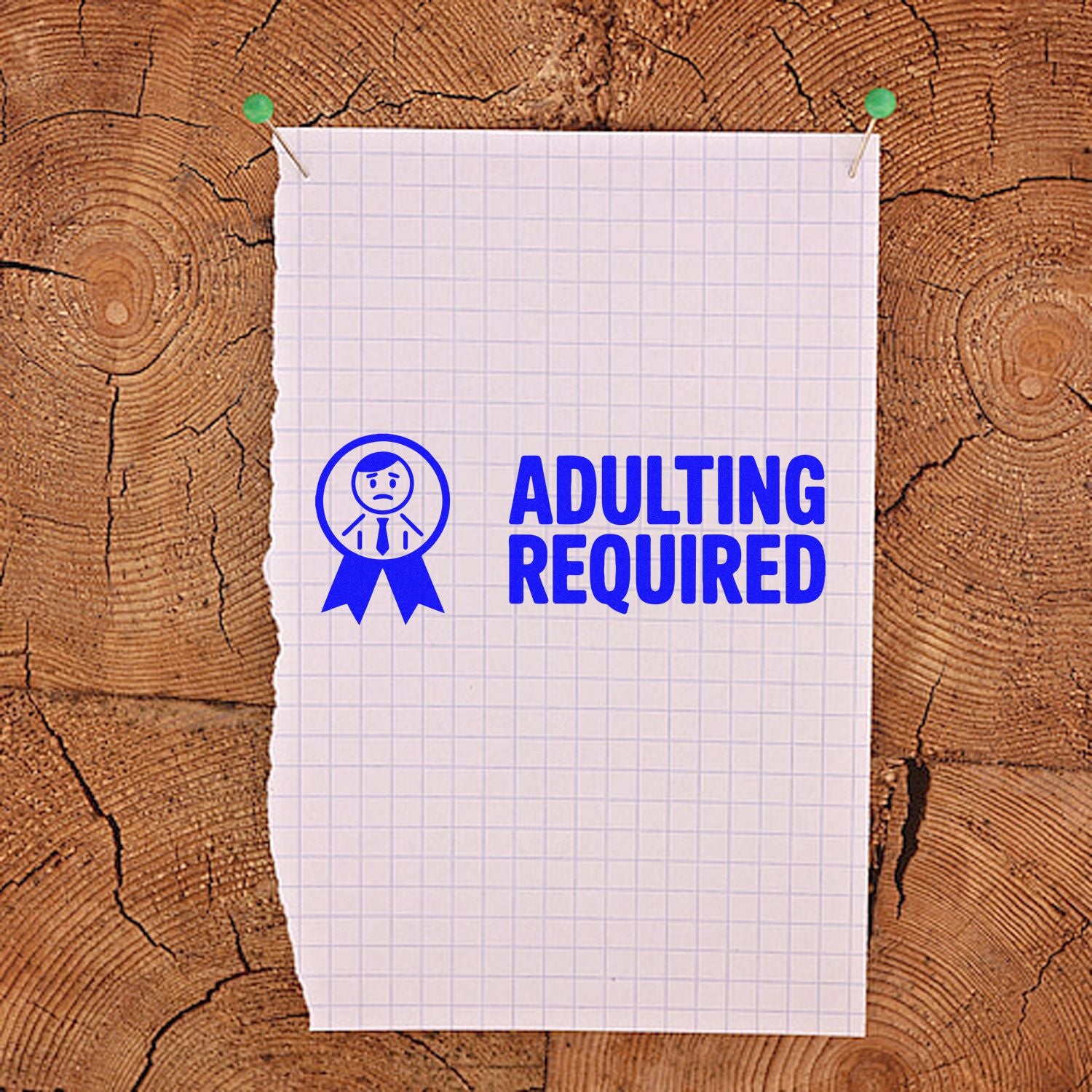 Blue Adulting Required stamp with seal icon on white graph paper, pinned over a rustic wood background.