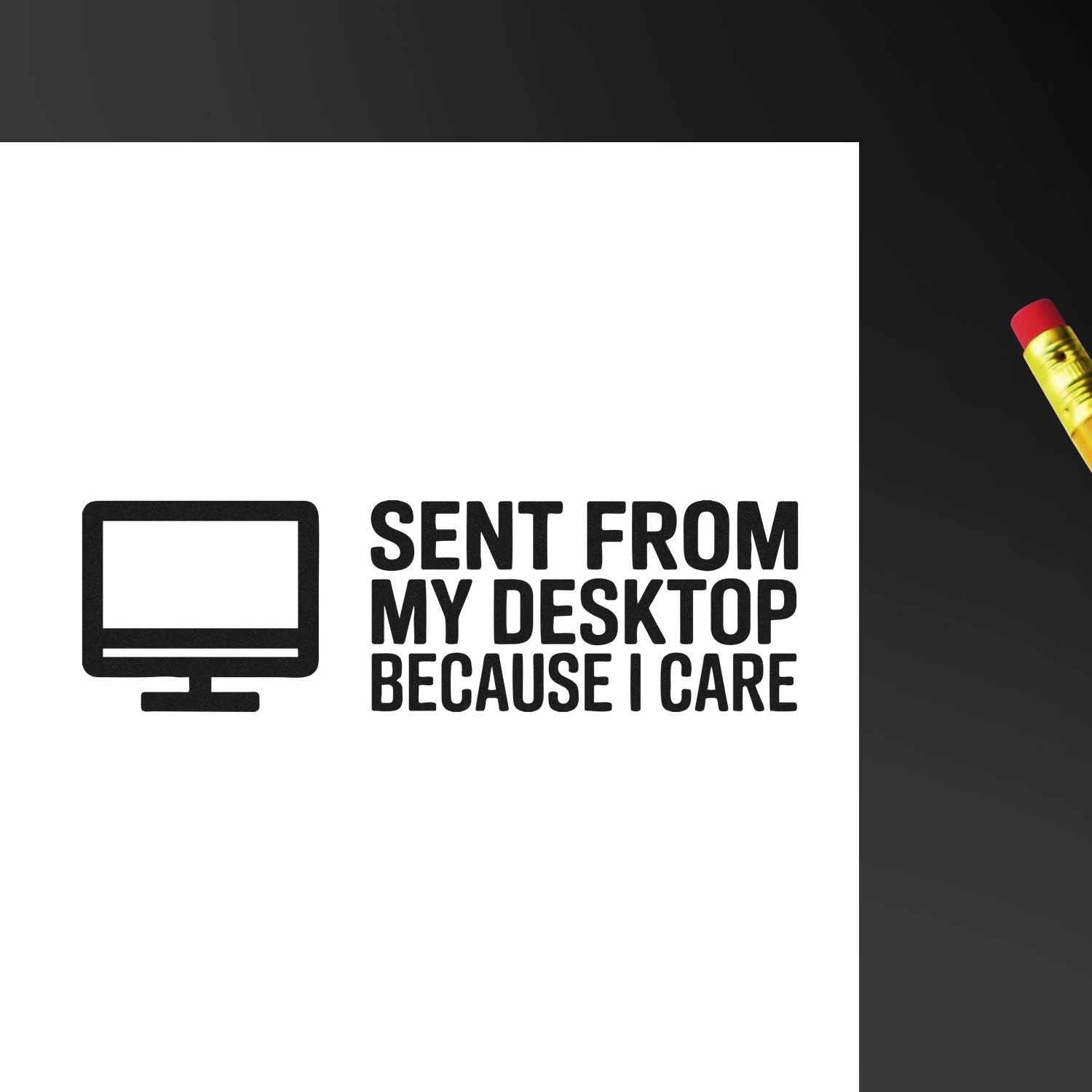 Black self-inking stamp seal with computer icon and Sent from my desktop because I care on white paper, red-and-gold pencil.