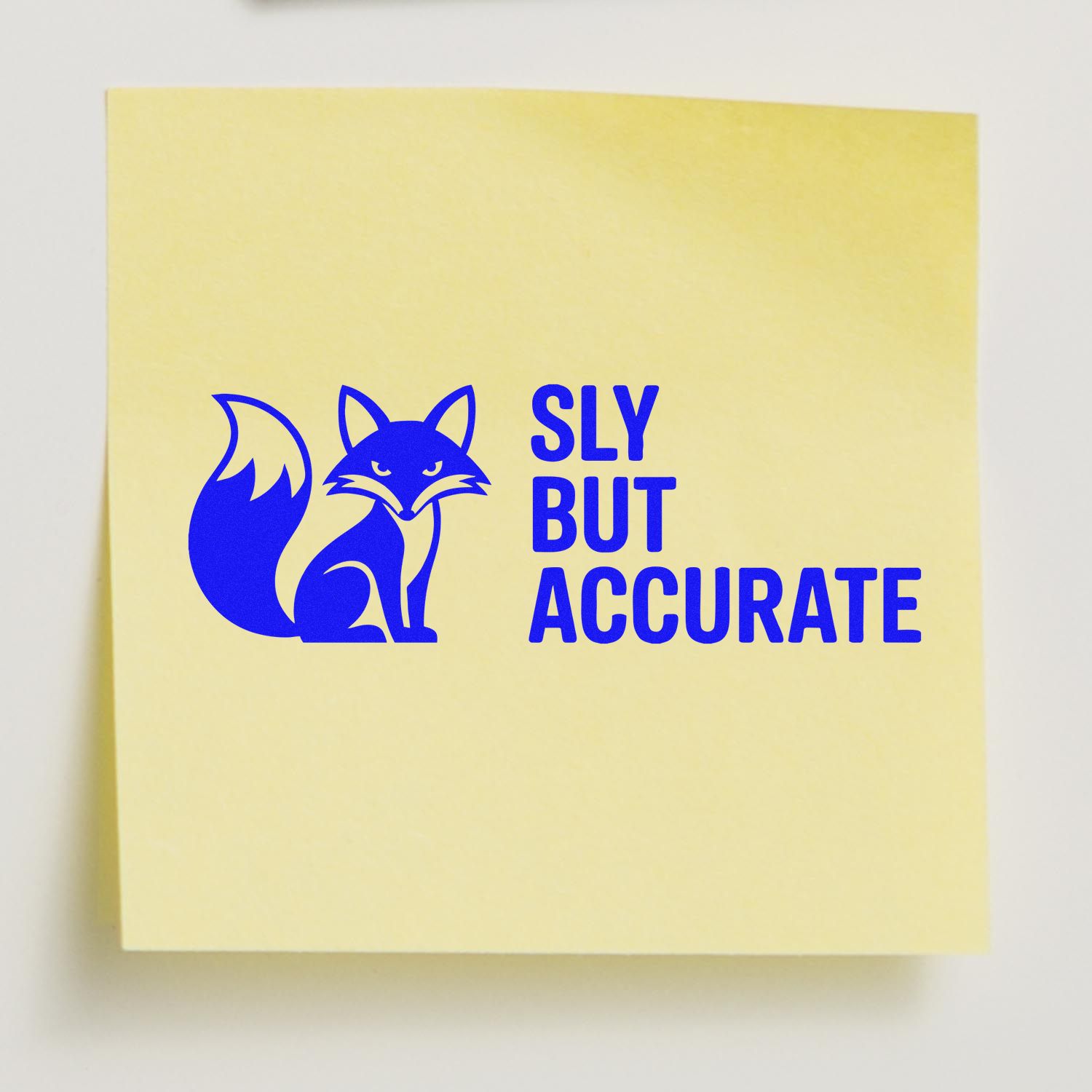 Yellow stamp and seal pad with blue fox logo and SLY BUT ACCURATE branding