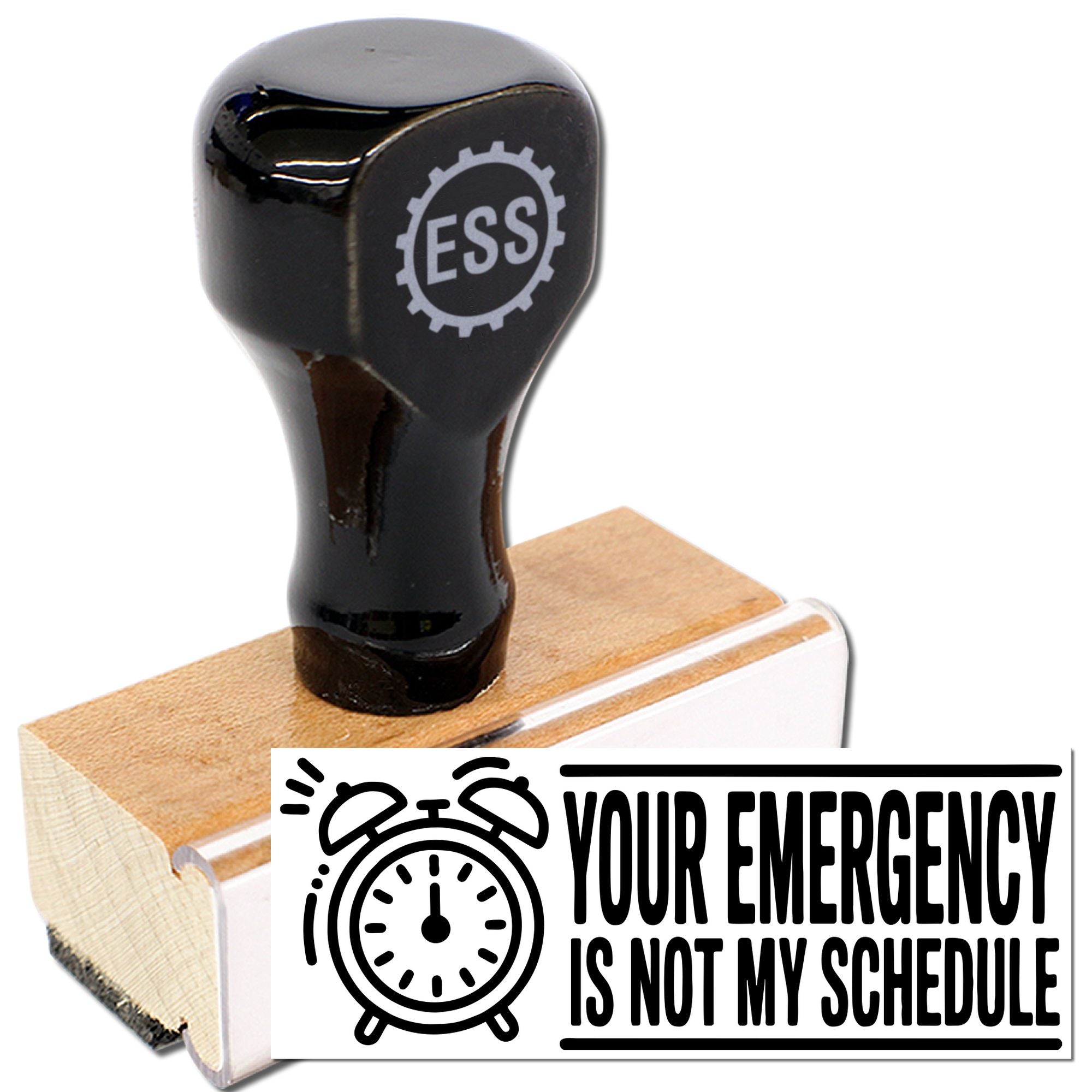 Black self-inking ESS stamp on wooden base with alarm-clock seal reading Your emergency is not my schedule