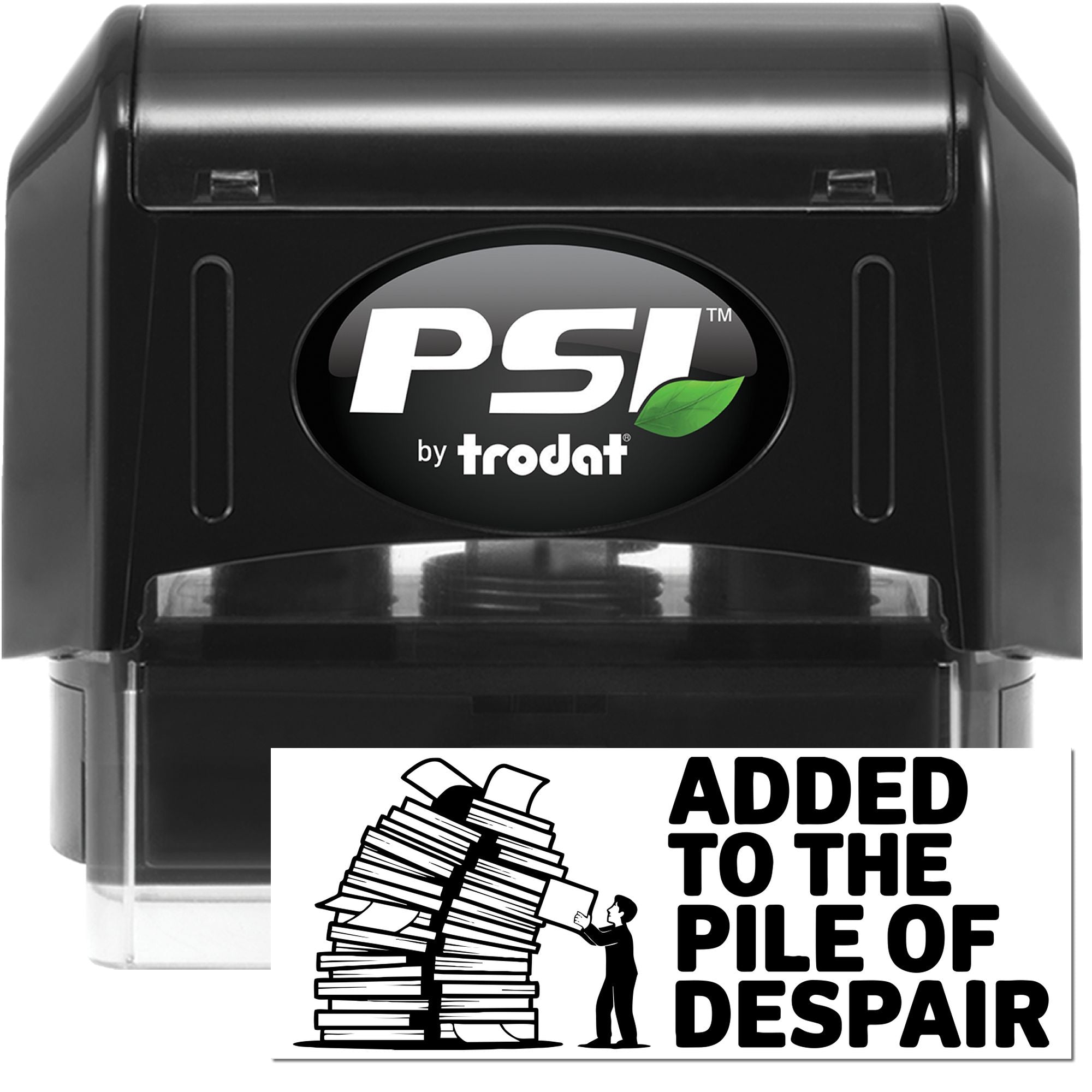 Black PSI by Trodat self-inking stamp with green leaf logo and clear base, plus Added to the Pile of Despair seal graphic.