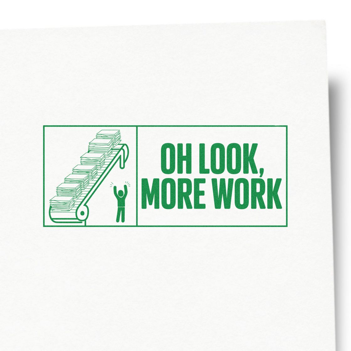 Green rubber stamp/seal reading OH LOOK, MORE WORK with a conveyor belt of papers and a tiny figure, all in green.