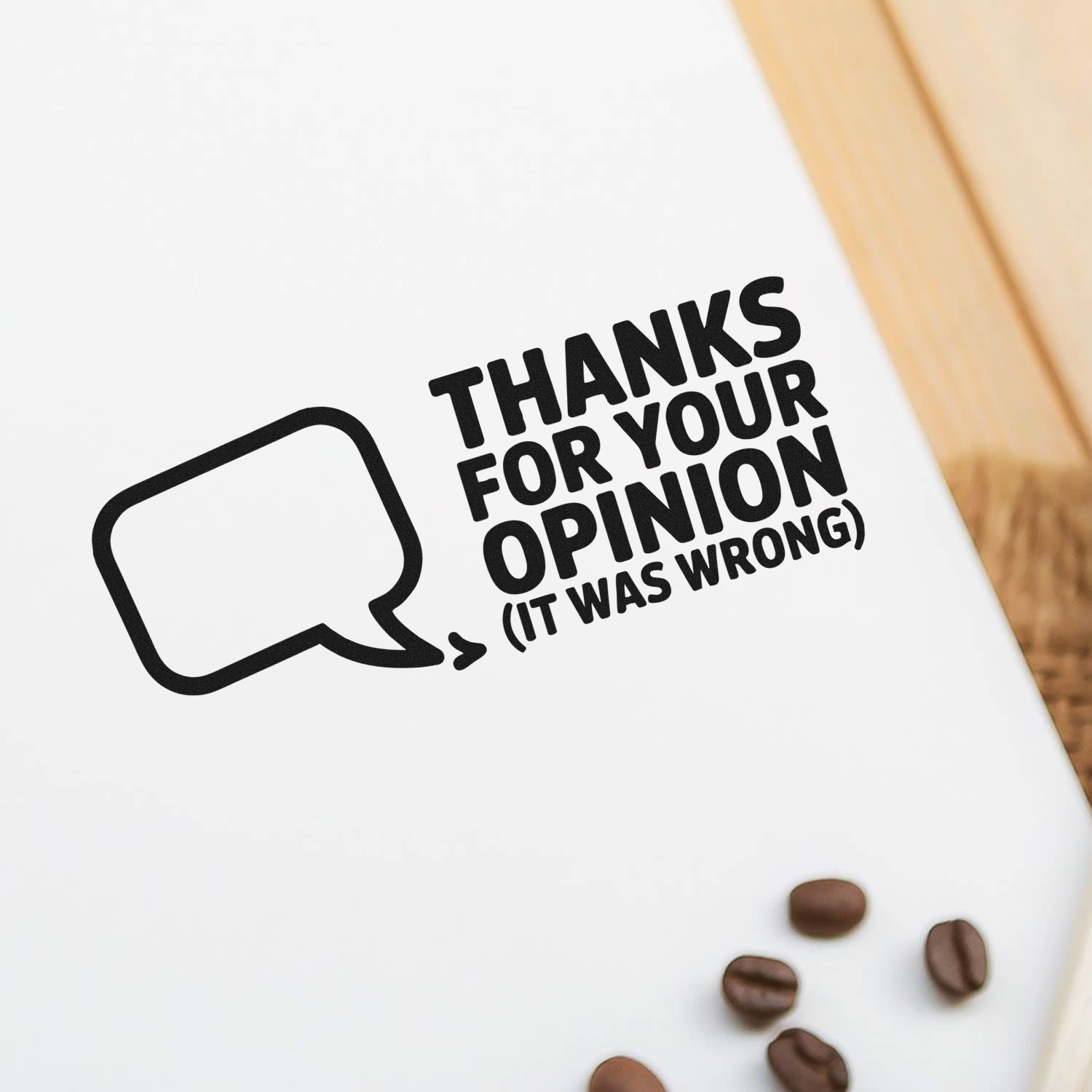Black custom stamp and seal on white packaging, with speech bubble and text: Thanks for your opinion (it was wrong).