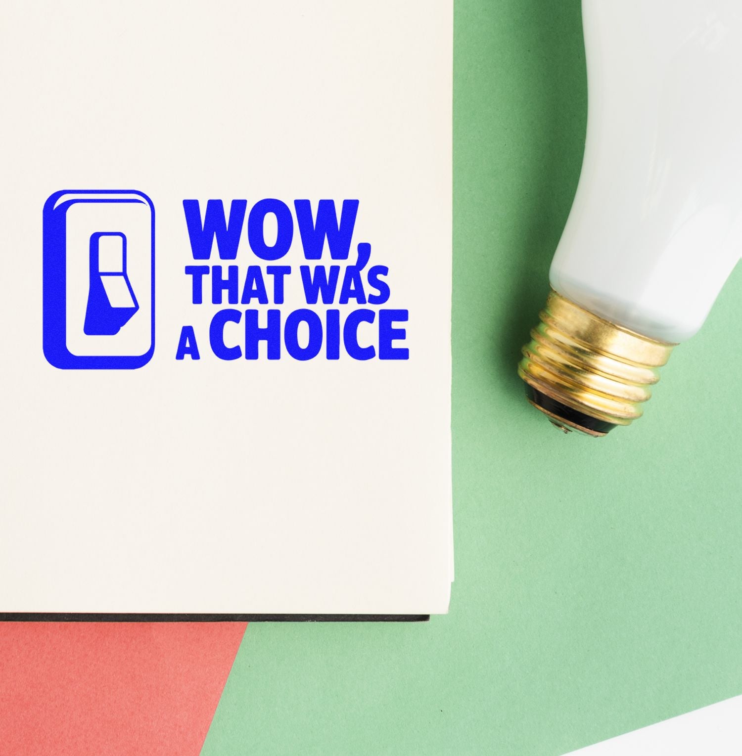 Blue rubber stamp reading WOW, THAT WAS A CHOICE beside a white seal with gold base on green and coral paper.