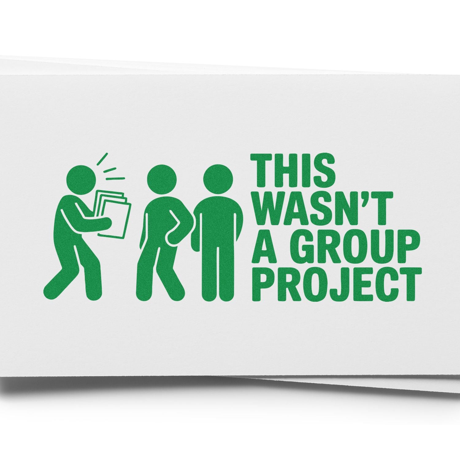 Green custom stamp on white paper with three figures and bold text: THIS WASNT A GROUP PROJECT.