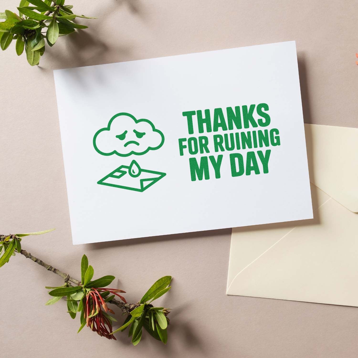 Green stamp and seal on white card: sad cloud over envelope with THANKS FOR RUINING MY DAY beside beige envelope and greenery.