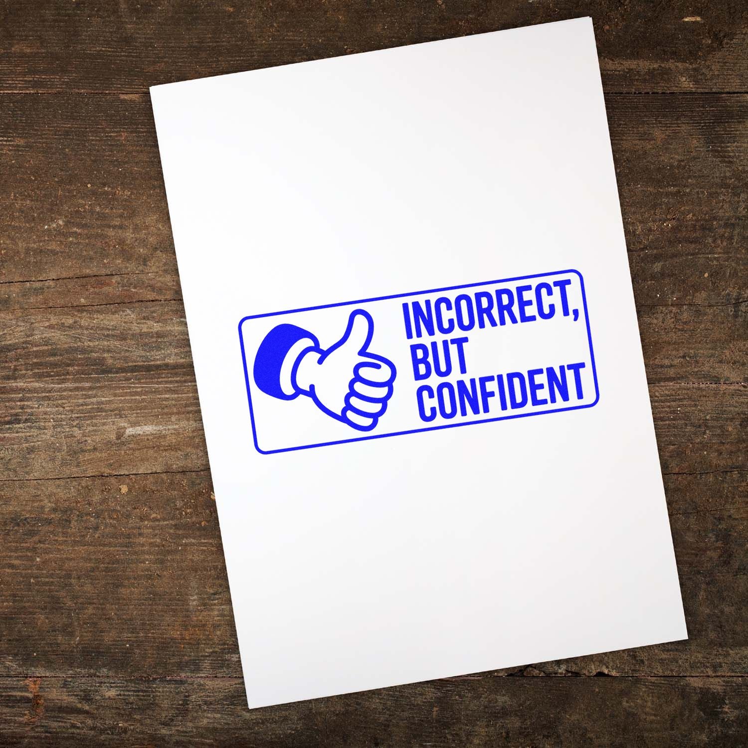 Blue stamp and seal with thumbs-up icon and Incorrect, but Confident on white paper over a dark wood background.