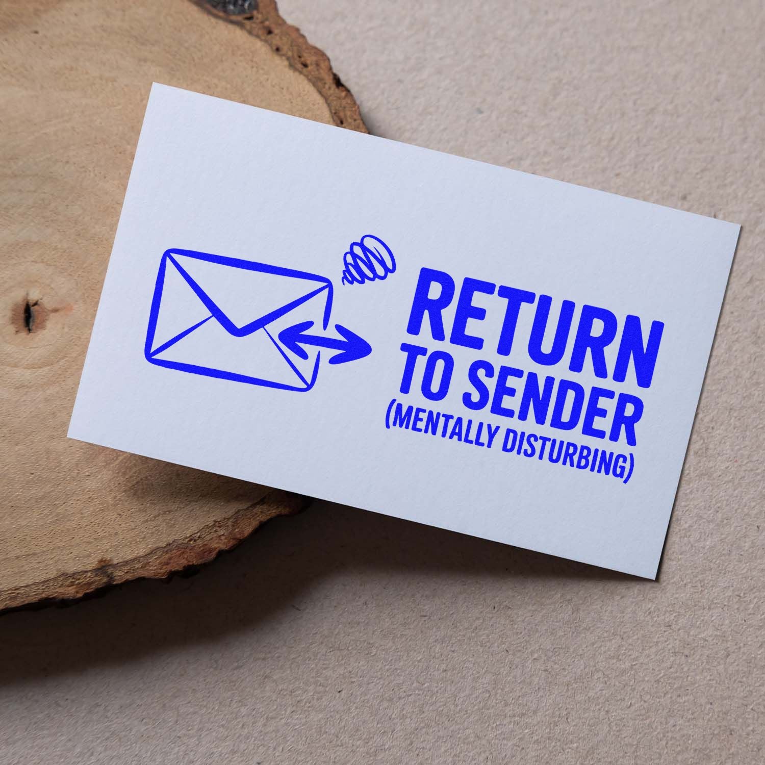 Blue return-to-sender stamp and seal with envelope icon and mentally disturbing text on a white card.