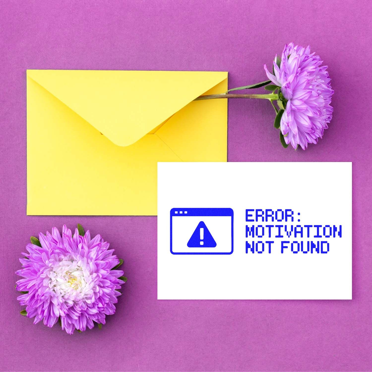 Yellow envelope on purple with lilac flowers and a white stamp seal reading ERROR: MOTIVATION NOT FOUND in blue.