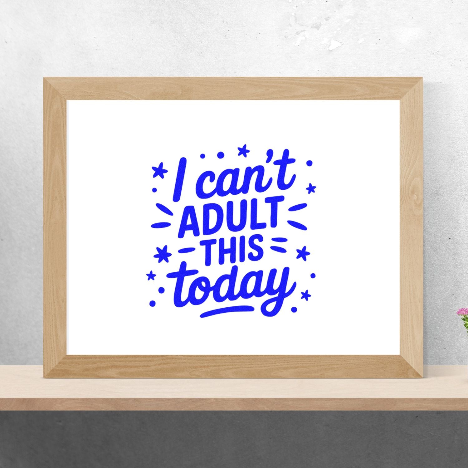 Blue stamp and seal design reading I cant ADULT THIS today in a light wood frame on a white background.