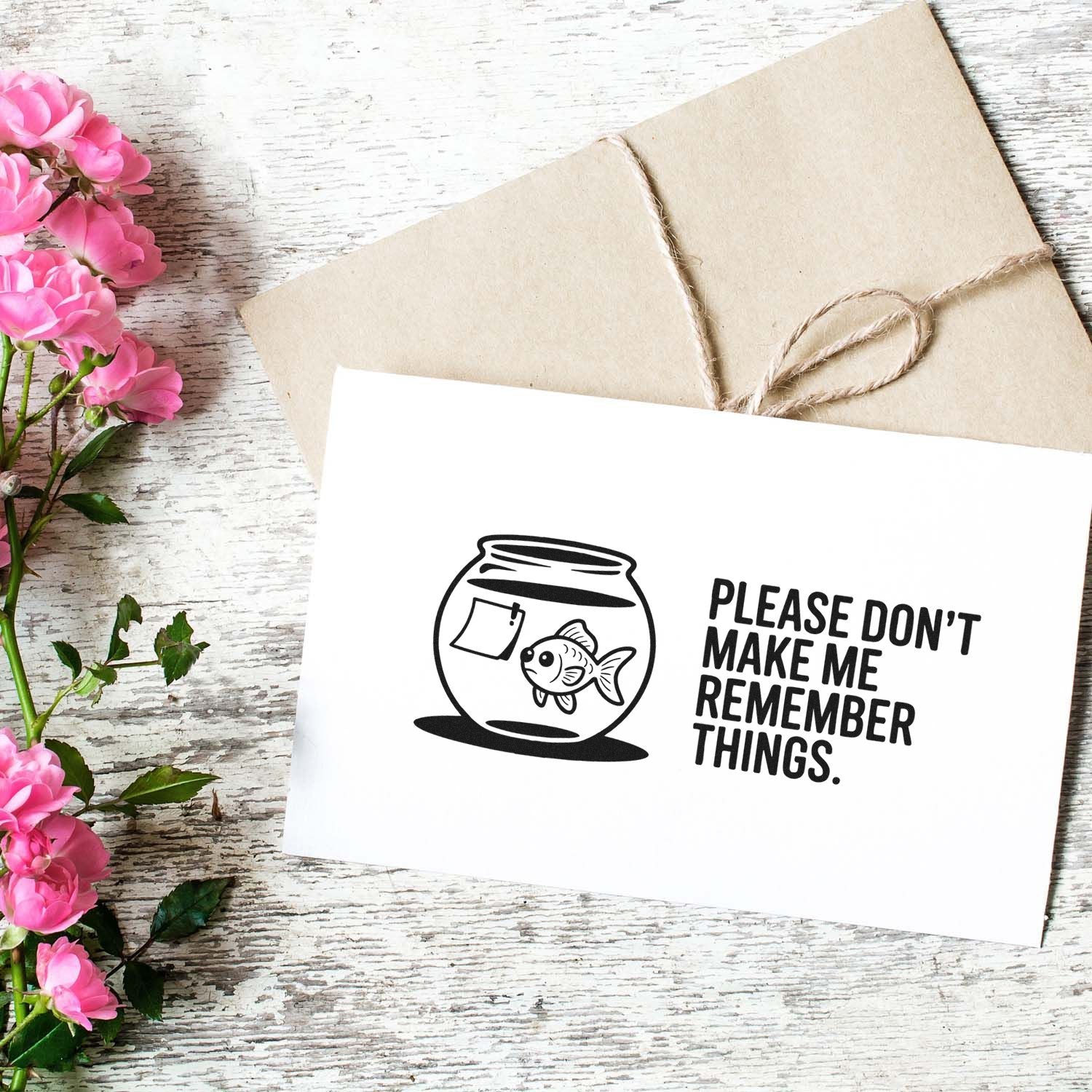 Custom black stamp and seal with fishbowl and Please dont make me remember things on white card, beige envelope, pink flowers