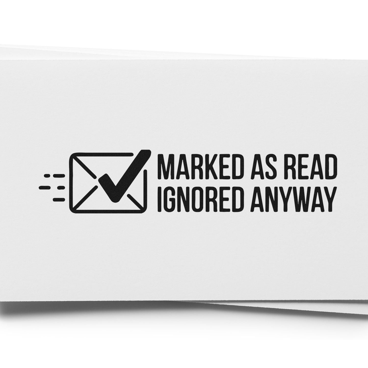 Black self-inking stamp reading Marked as Read, Ignored Anyway with envelope checkmark on white paper.