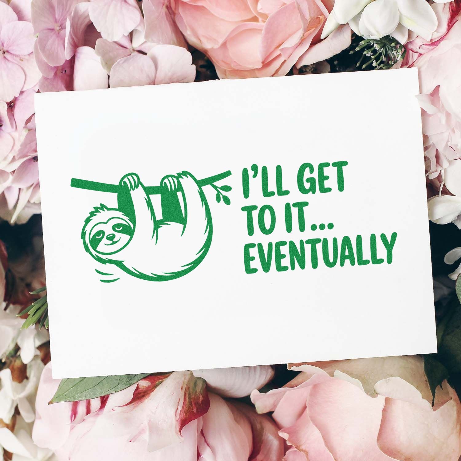 Green sloth rubber stamp design on white card with Ill get to it... eventually in green, surrounded by pink flowers.