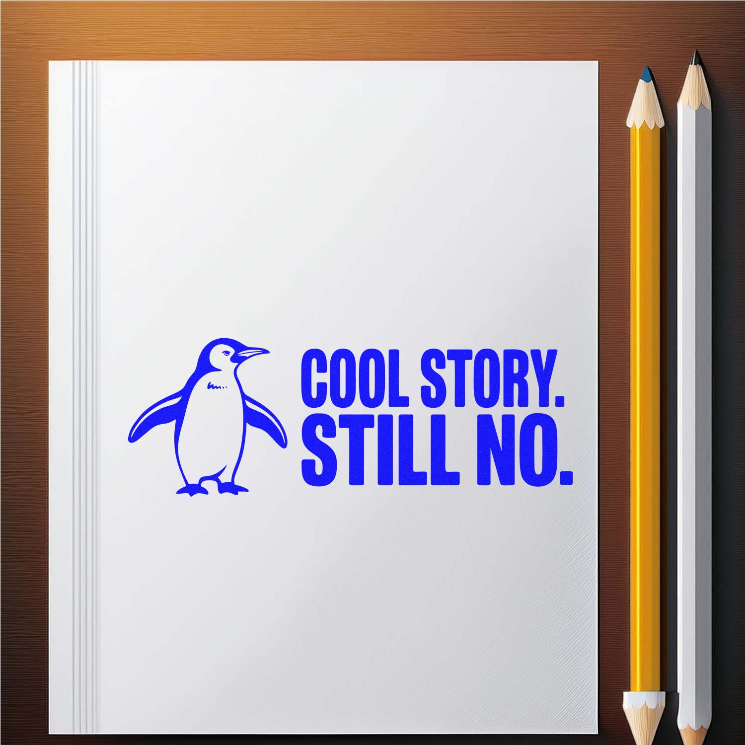 Blue custom stamp/seal with penguin and COOL STORY. STILL NO. in bold blue on white paper, beside yellow and white pencils.