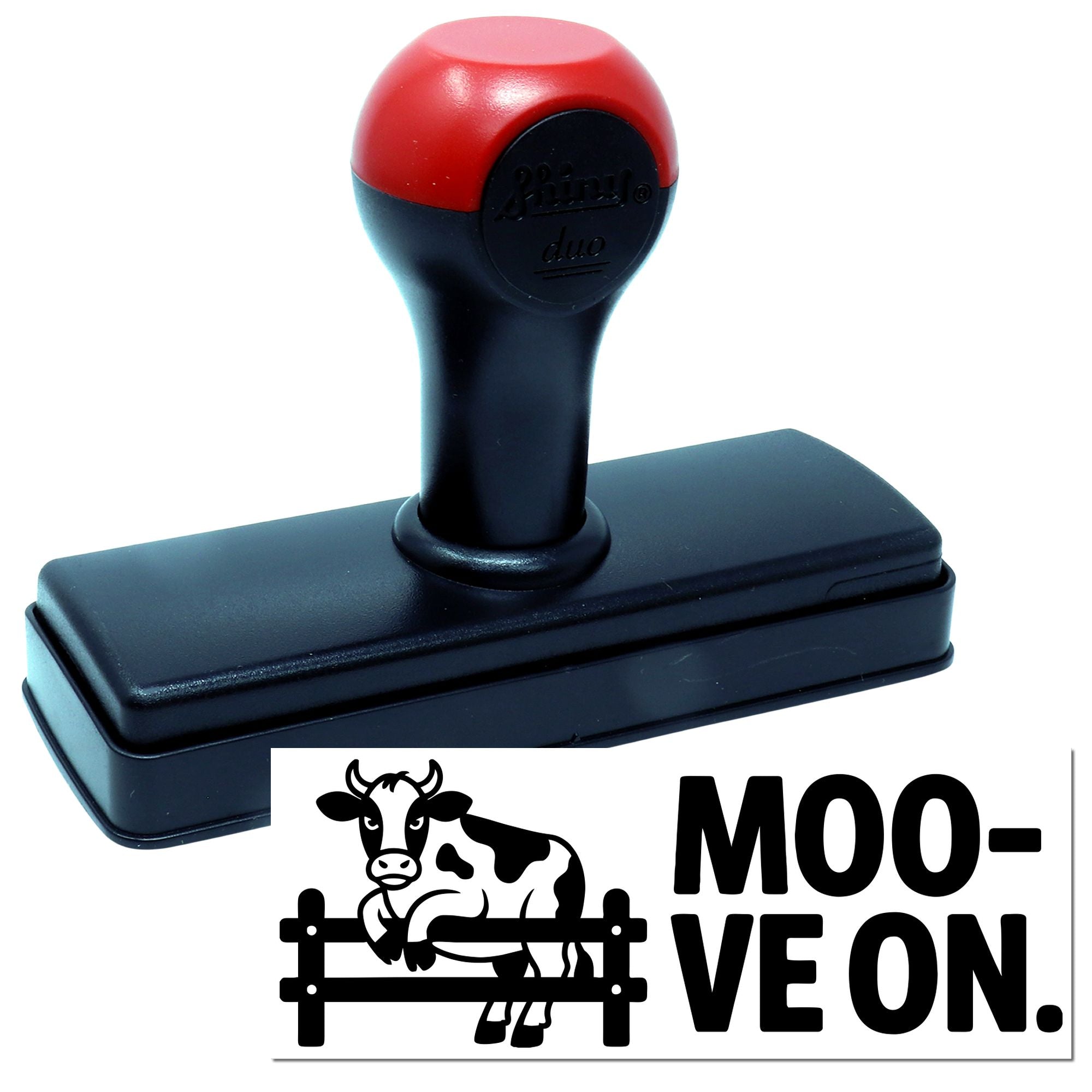 Black self-inking stamp with red top handle and custom cow seal reading MOO-VE ON.