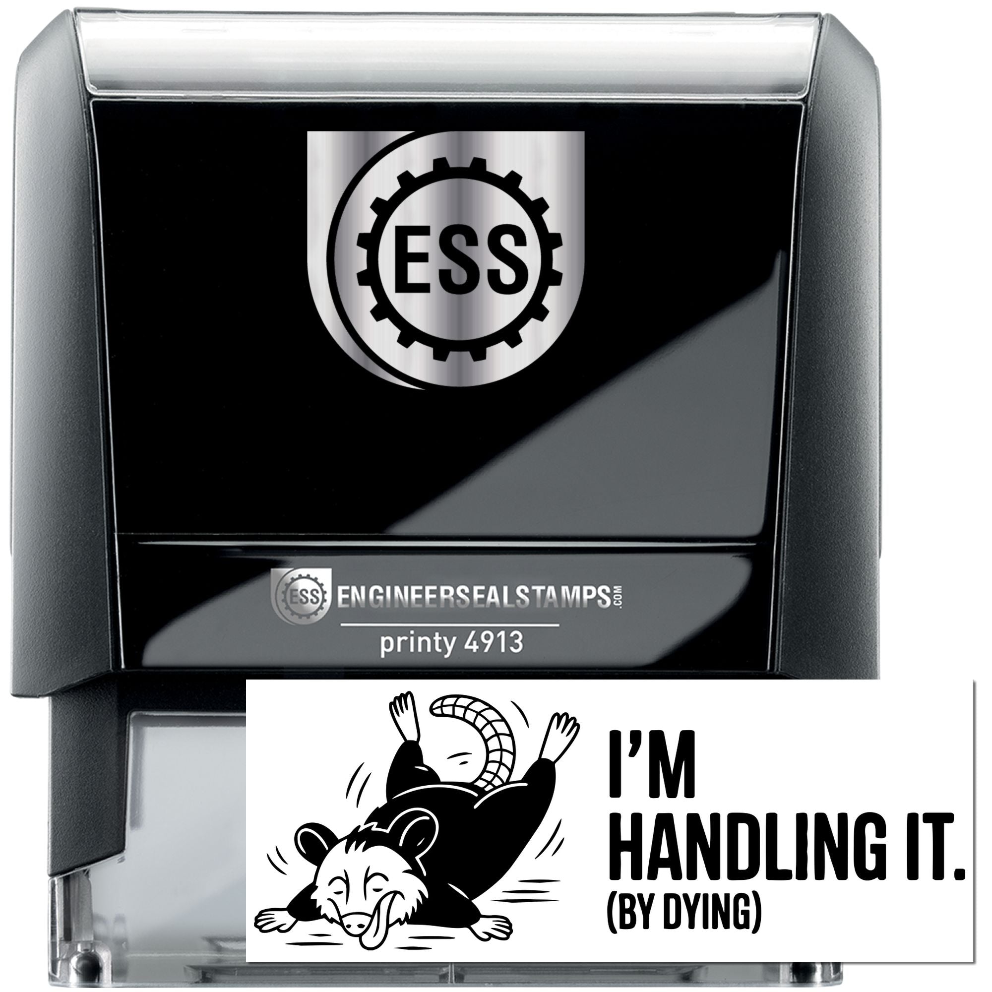 Black self-inking stamp and seal with silver trim, ESS gear logo, and humorous Im Handling It (By Dying) imprint.