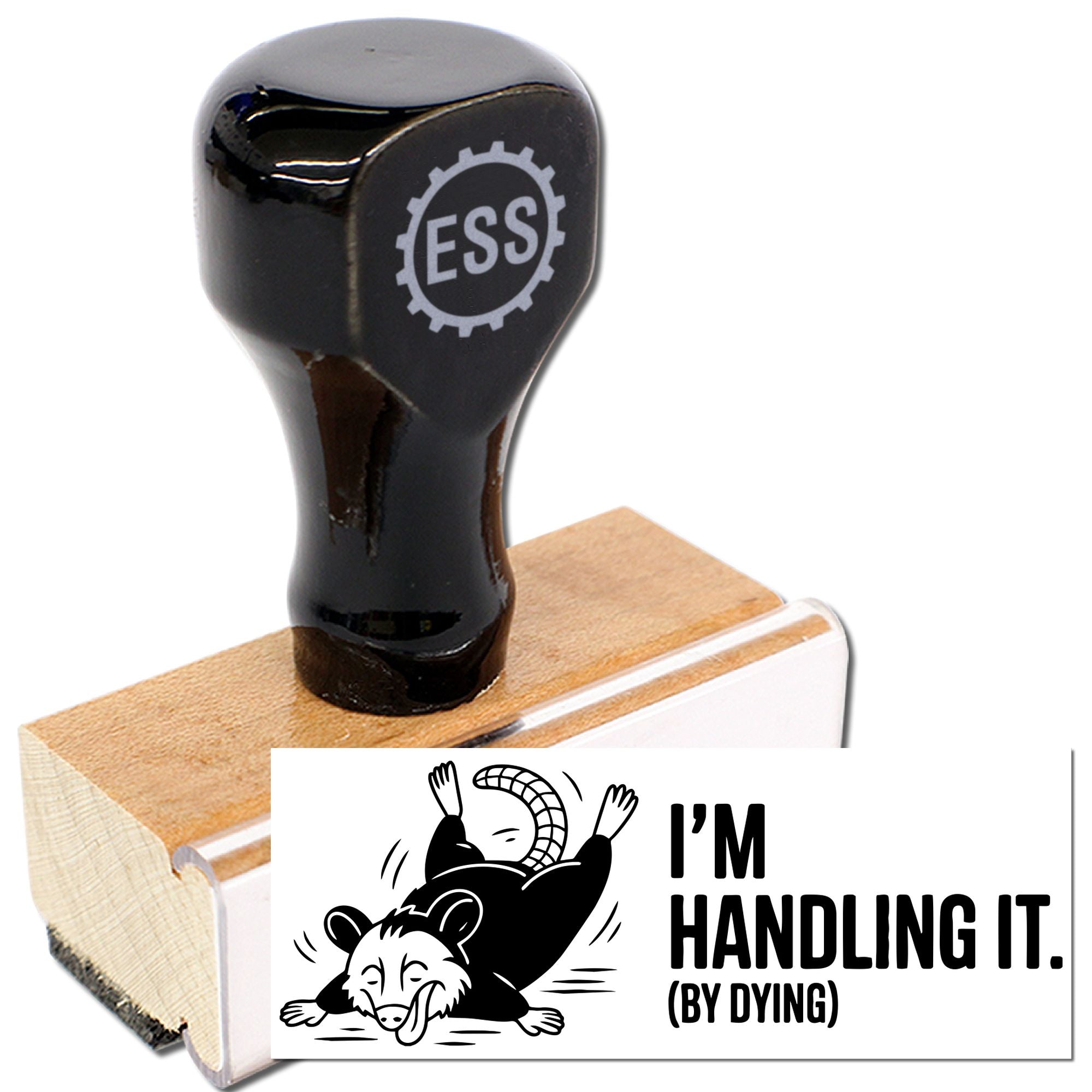 Black rubber stamp and seal on a wooden base, with black-and-white Im handling it (by dying) design.