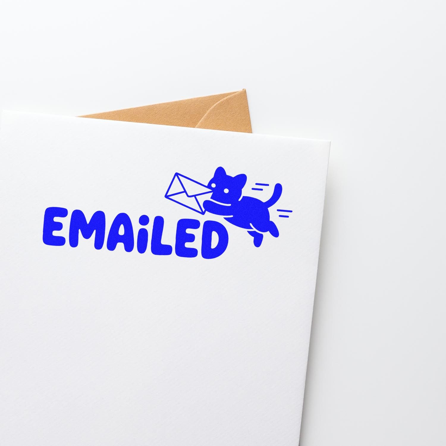 Blue Emailed stamp seal with running cat and envelope on a white mailer, with a brown envelope peeking out behind.