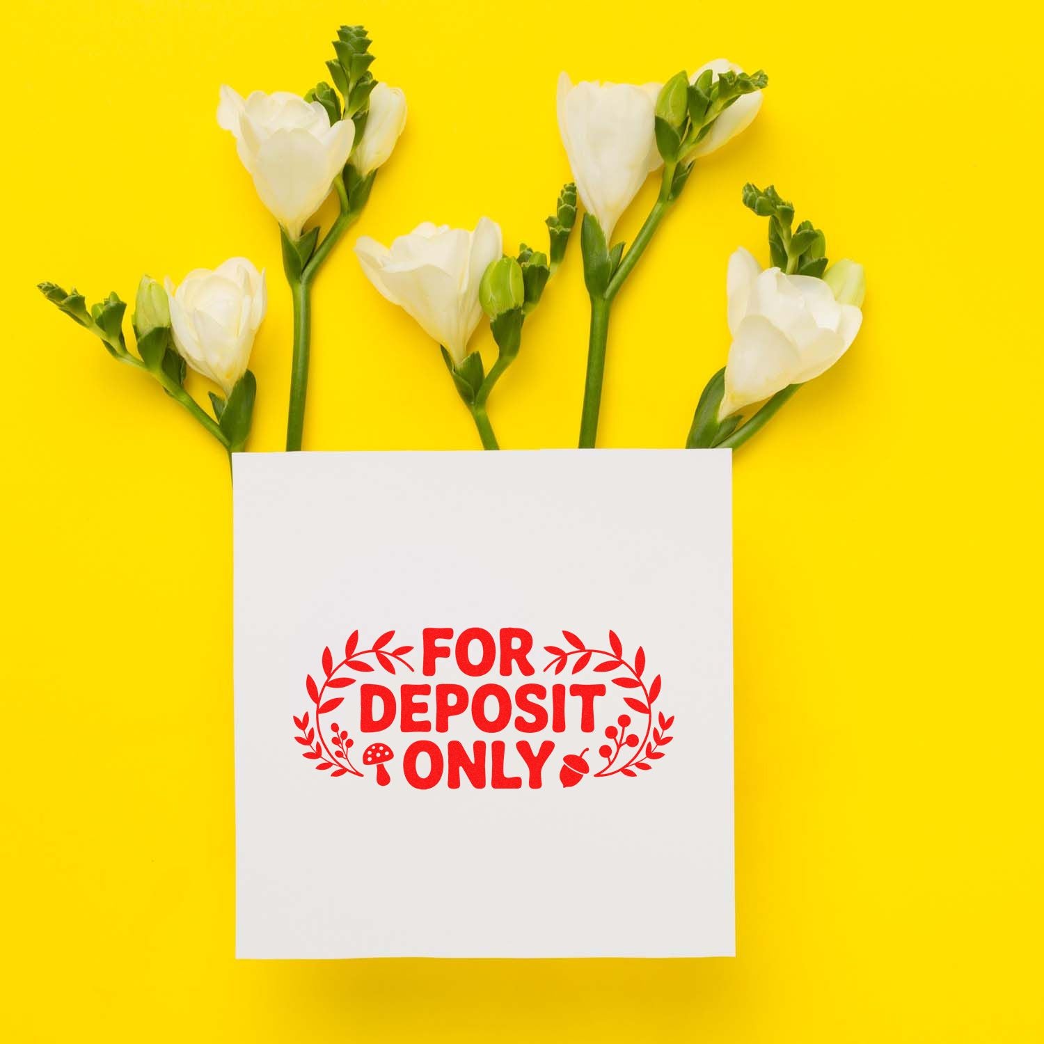 White flowers on yellow background with a white card stamped in red FOR DEPOSIT ONLY seal design.