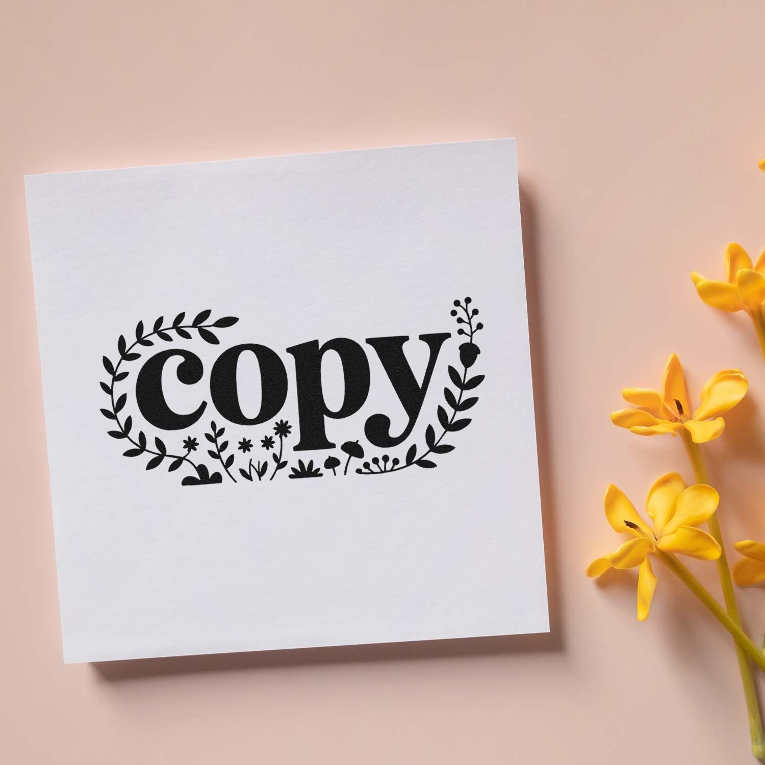 Black floral copy stamp on white card, with yellow flowers on a peach background, showcasing a stamp and seal design.