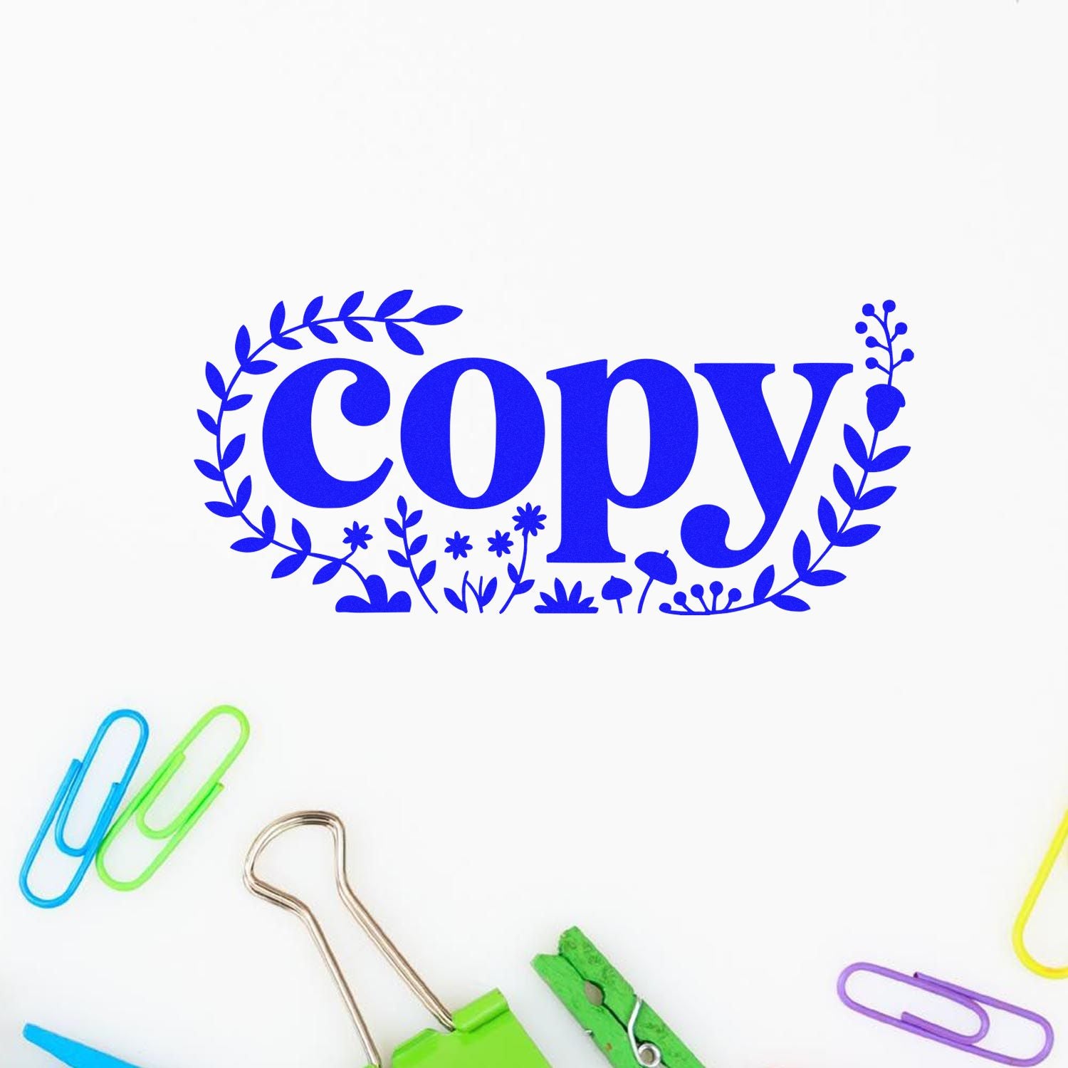 Blue decorative copy stamp and seal with leafy floral border, surrounded by colorful paper clips on a white background.