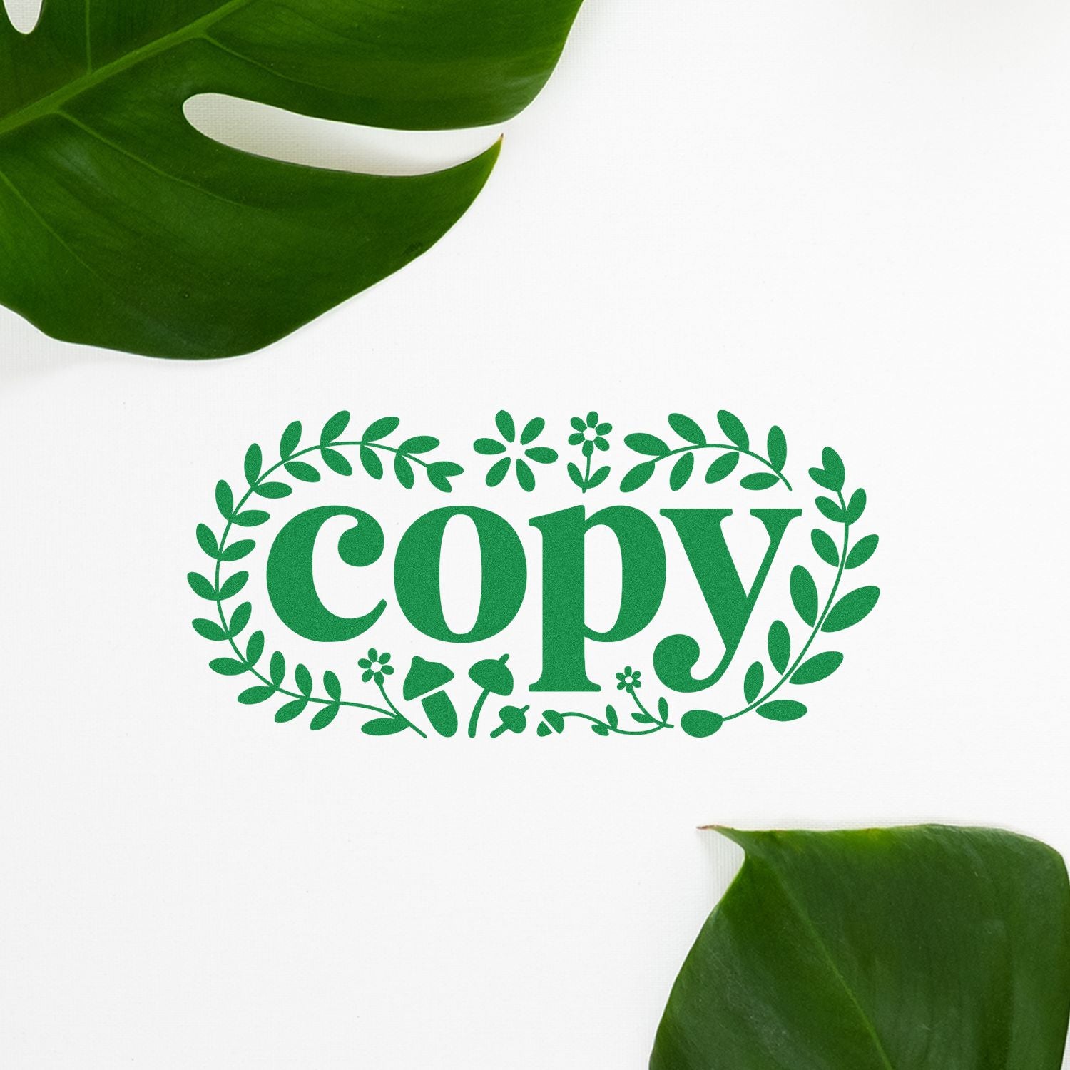Green copy stamp and seal logo in a leafy wreath, with tropical leaves on a white background.