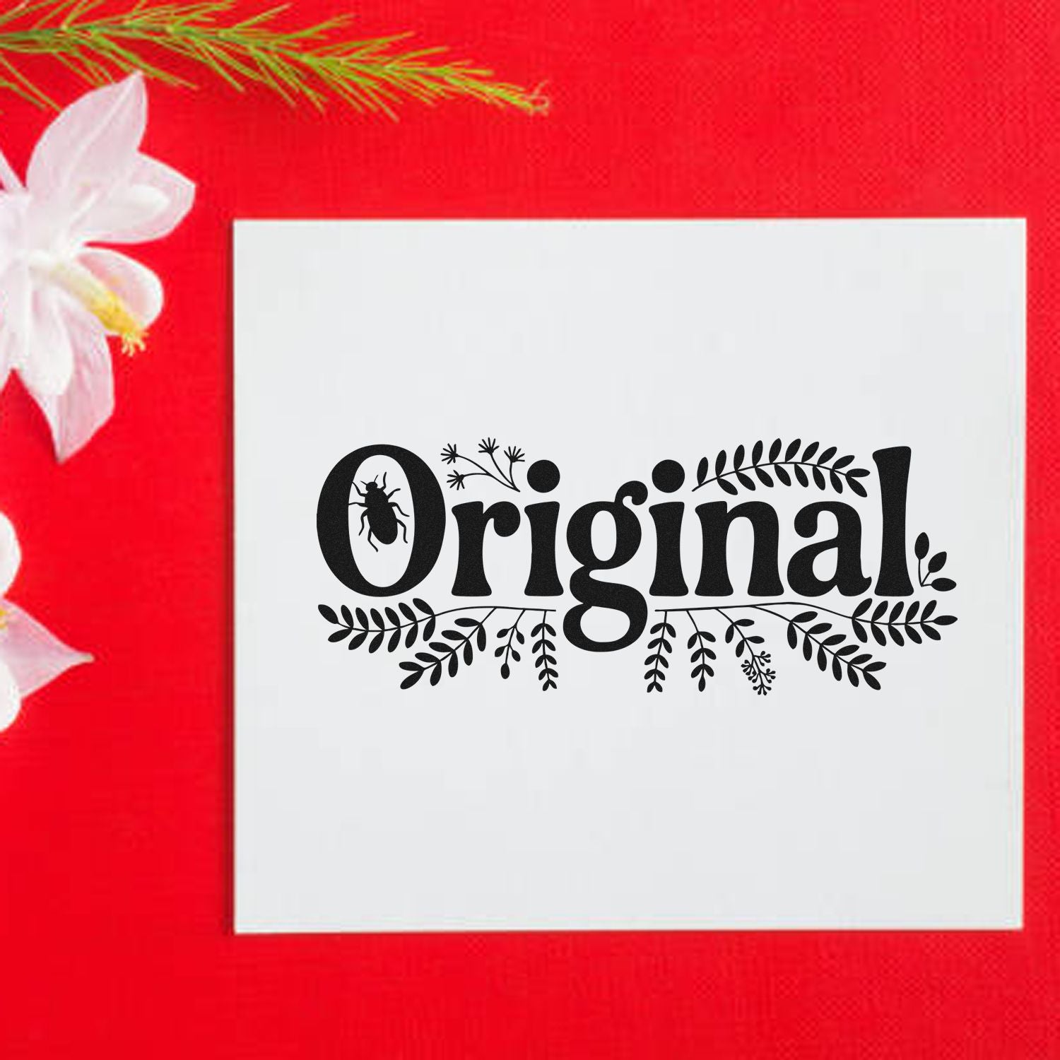Black Original decorative stamp seal on a white card, with leaf and bug motifs, on a bright red background with white flowers.