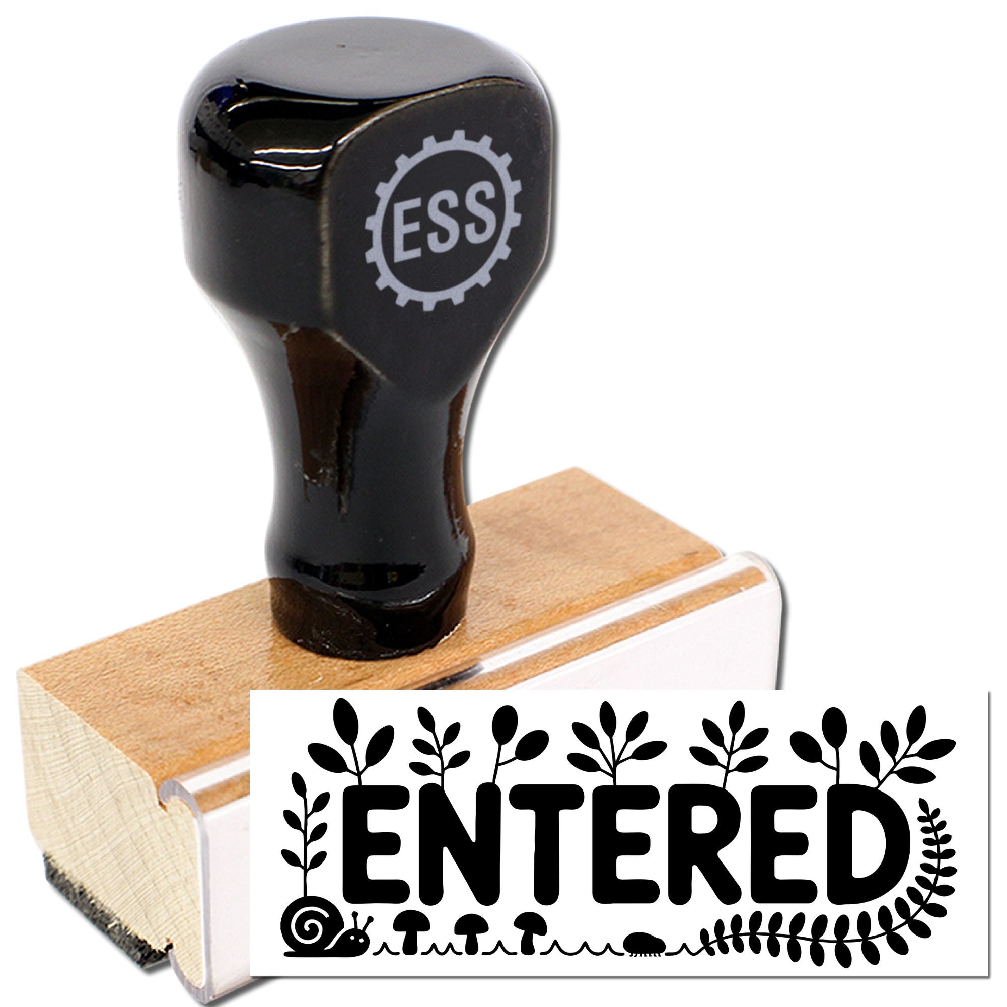 Black rubber stamp and wooden seal with ENTERED design, decorative leaves, and white background.