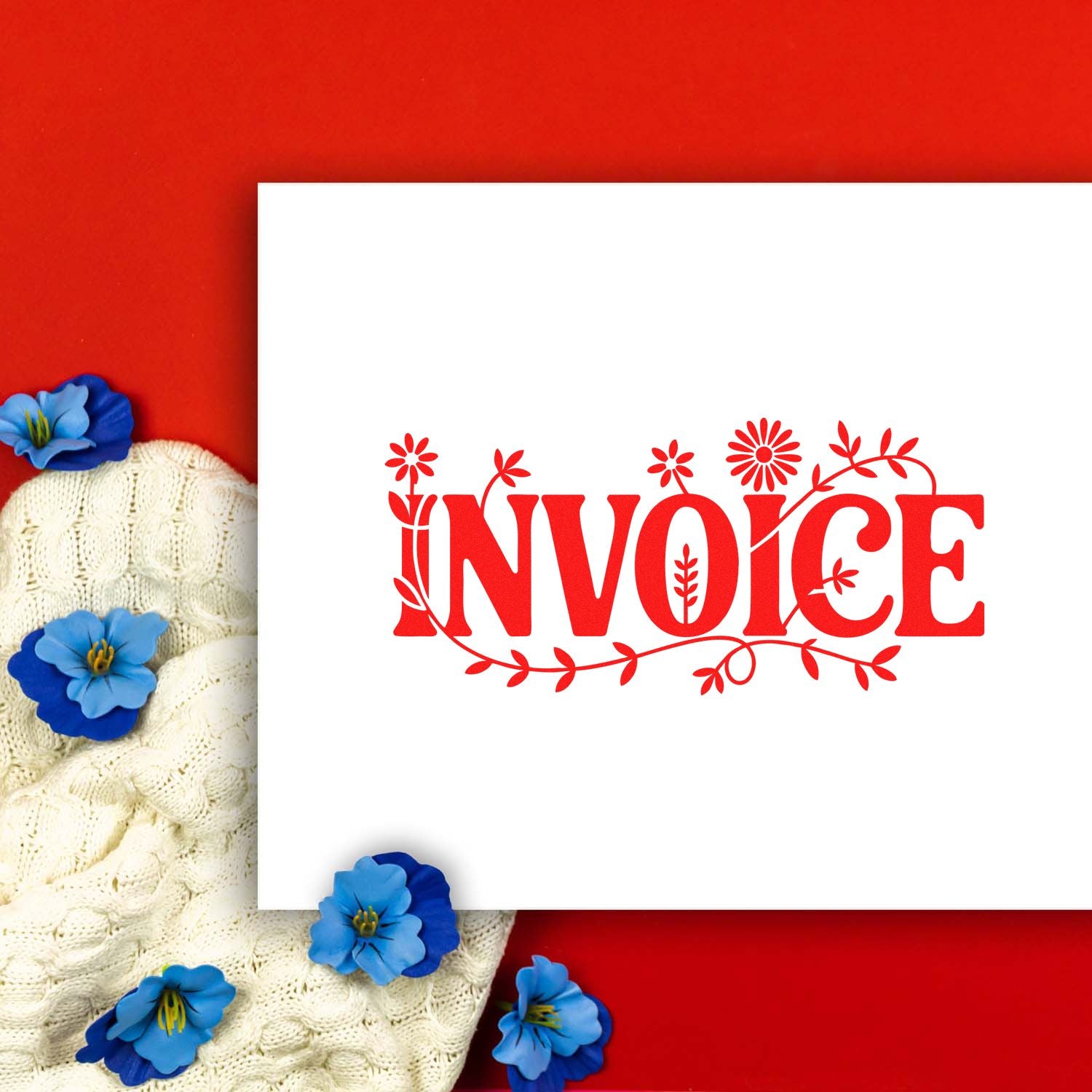 Red floral INVOICE stamp and seal design on white card, with blue flowers on a red background and cream knit fabric.
