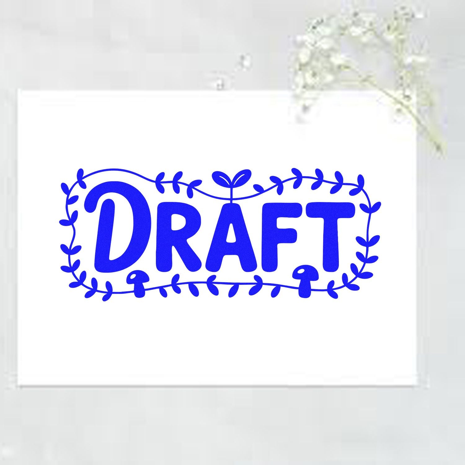 Blue DRAFT stamp seal with leafy border on white cardstock