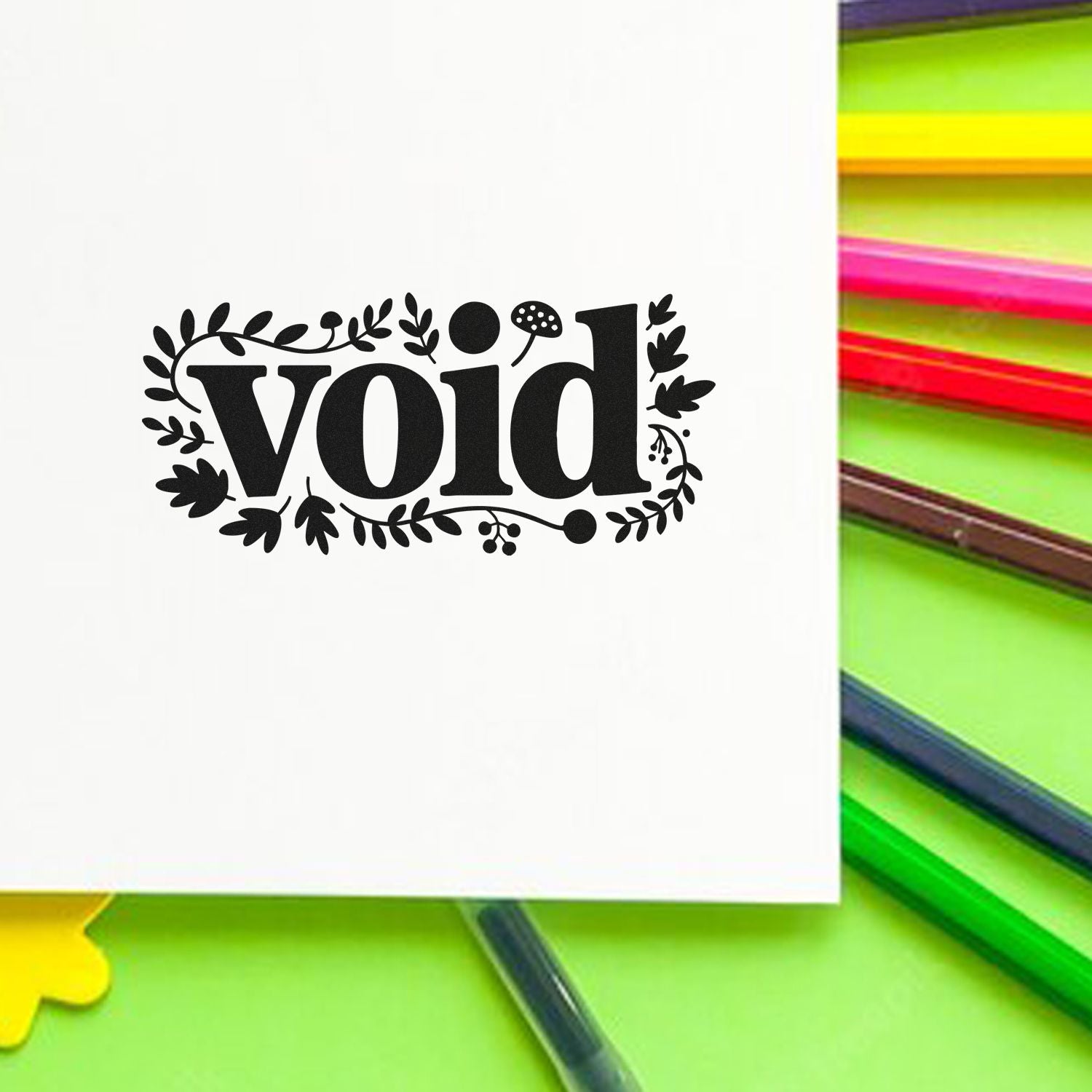 Black decorative void stamp seal with floral border on white card, beside neon green, yellow, and pink sticky notes.