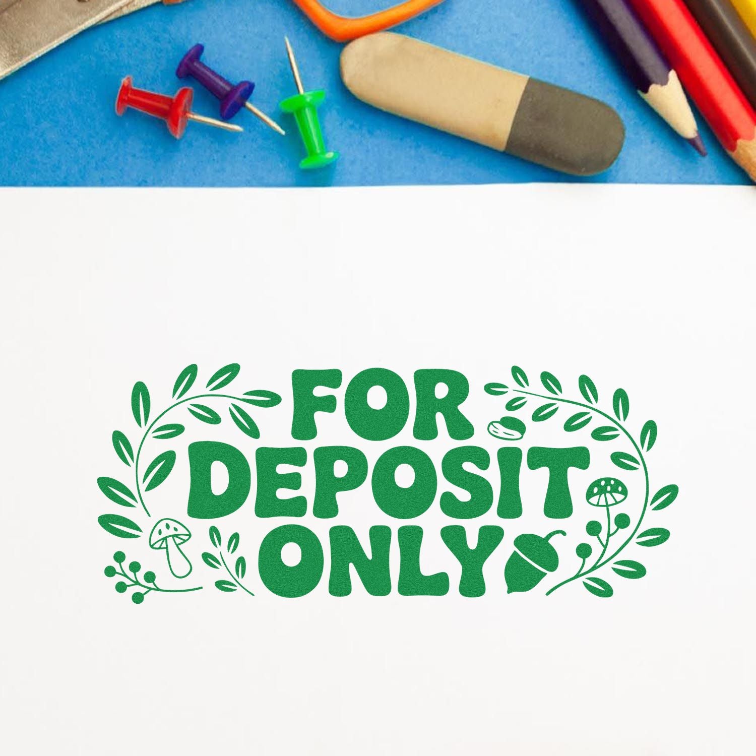 Green FOR DEPOSIT ONLY bank stamp seal on white paper, surrounded by colorful thumbtacks, pencil tips, and stationery.
