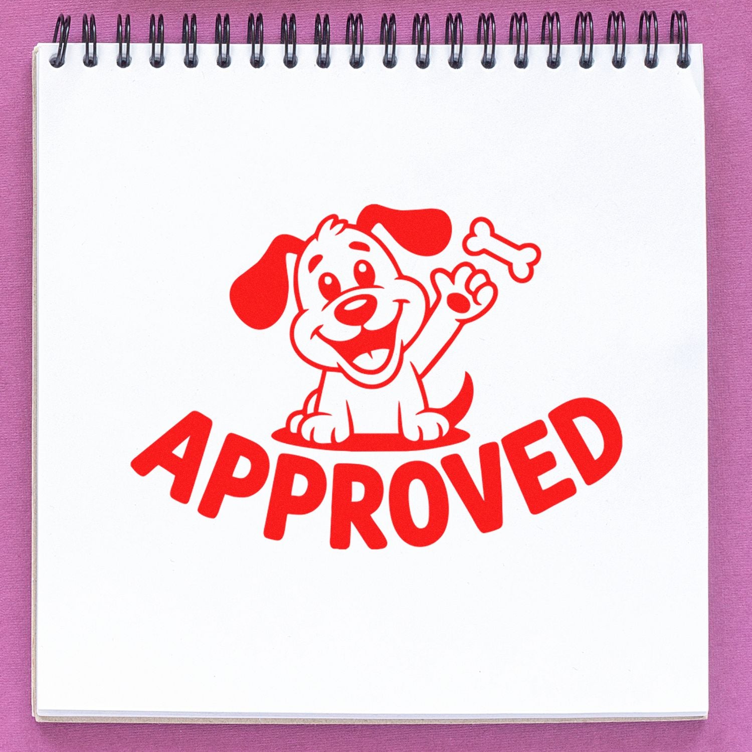 Red approved stamp seal with smiling cartoon dog and bone on a white spiral notebook, set against a purple background.