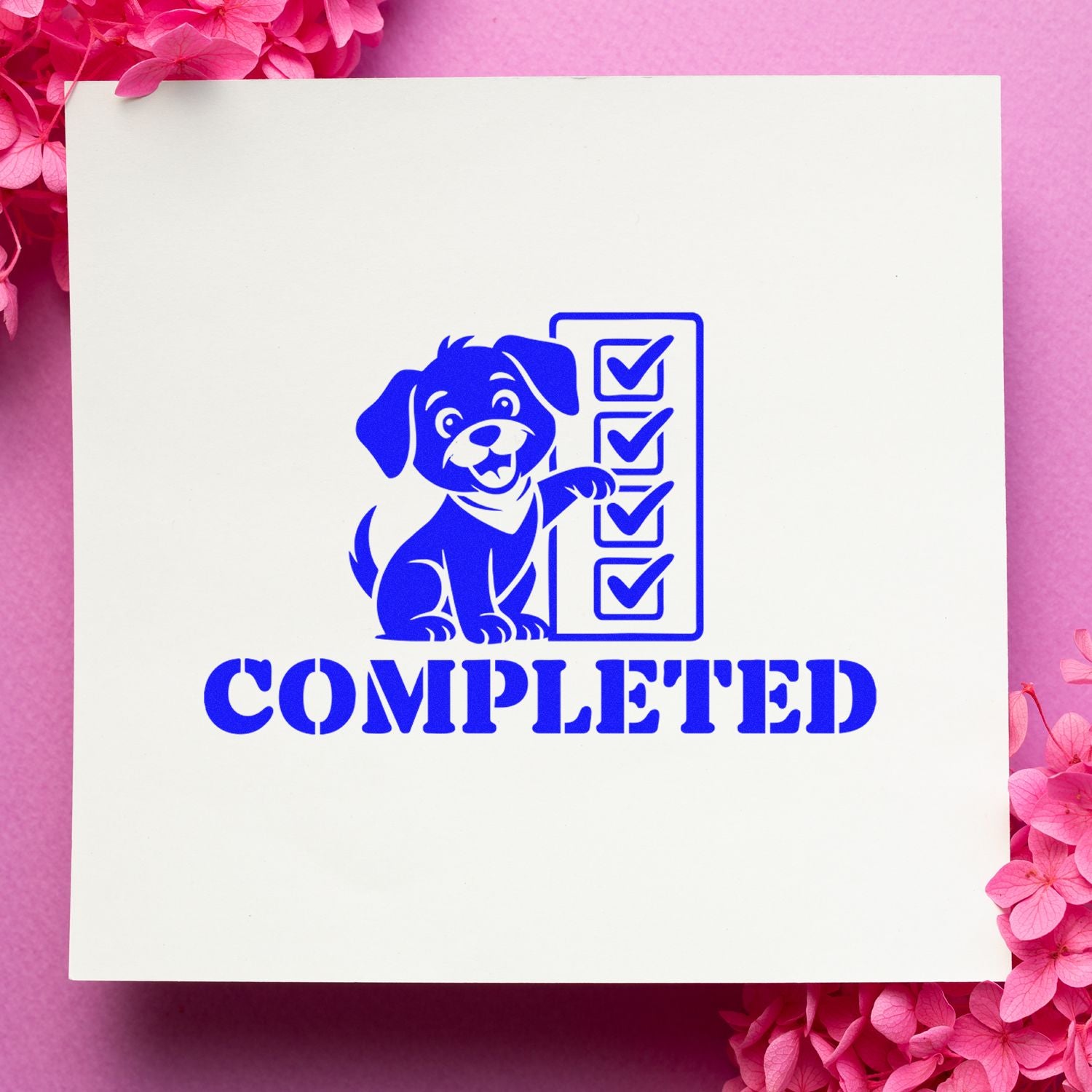 Blue rubber stamp seal with dog and checkmarks, reading COMPLETED, on white card with pink flowers.