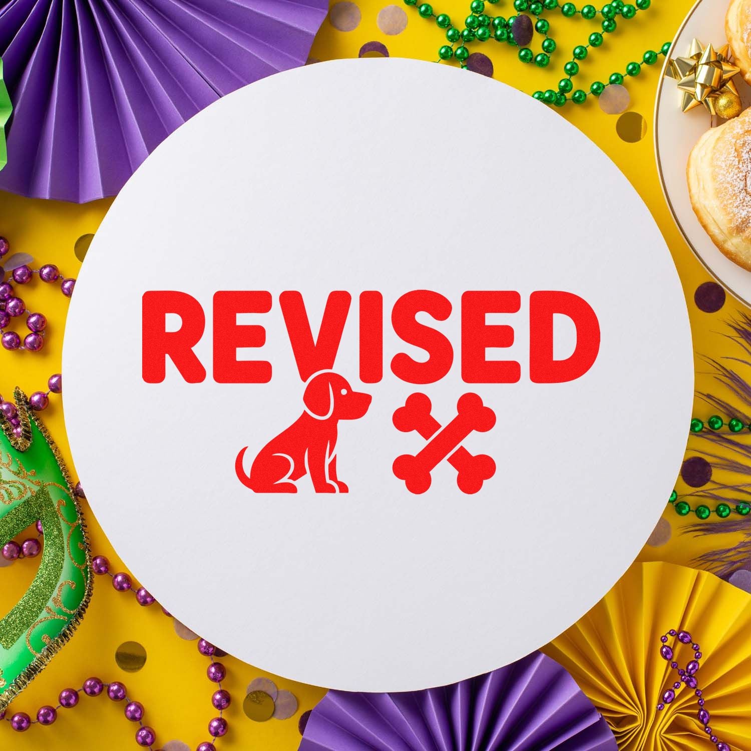 Red REVISED stamp with dog and bones on a white seal, surrounded by purple, gold and green Mardi Gras decorations.