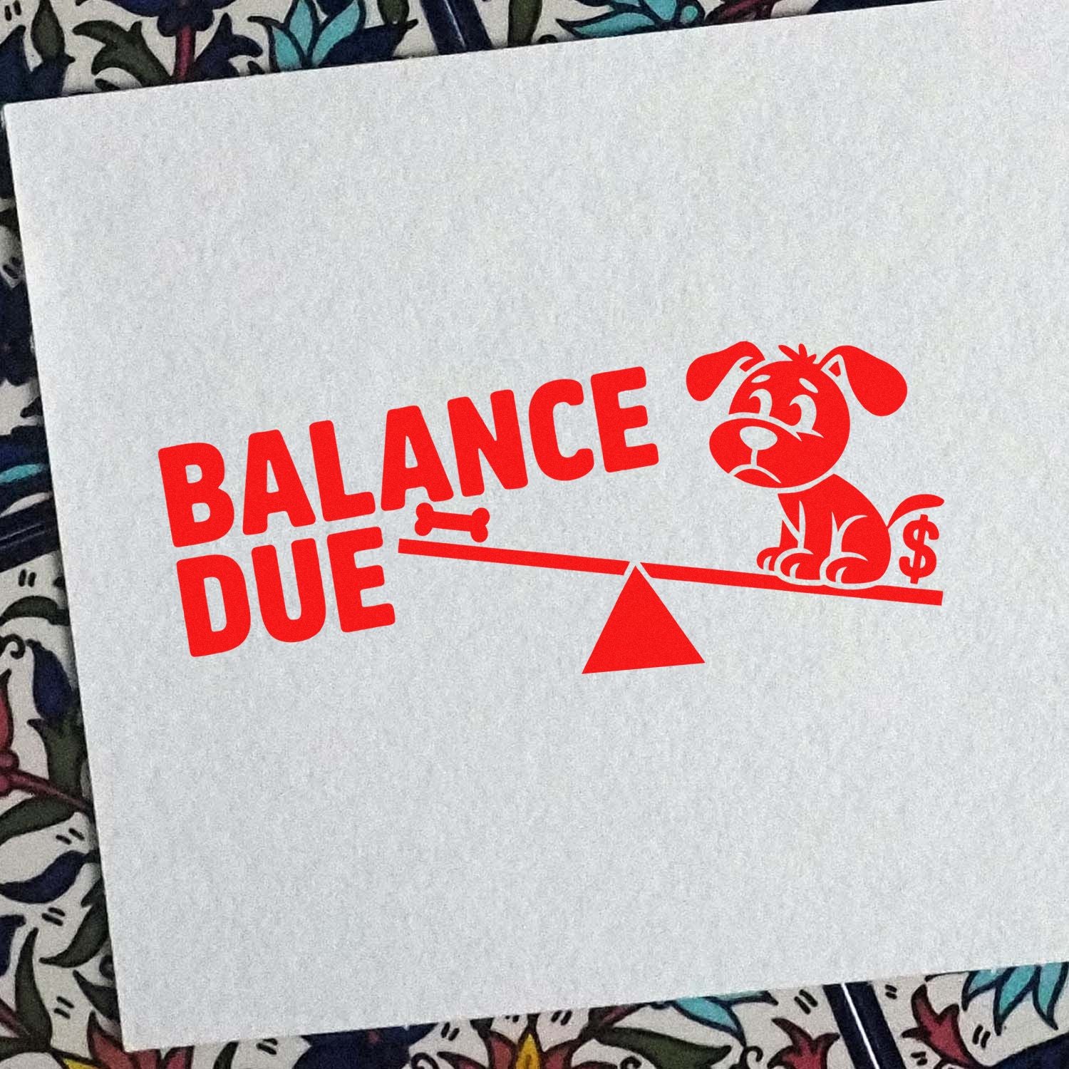 Red Balance Due stamp and seal with sad dog, bone, scale, and dollar sign on white paper.