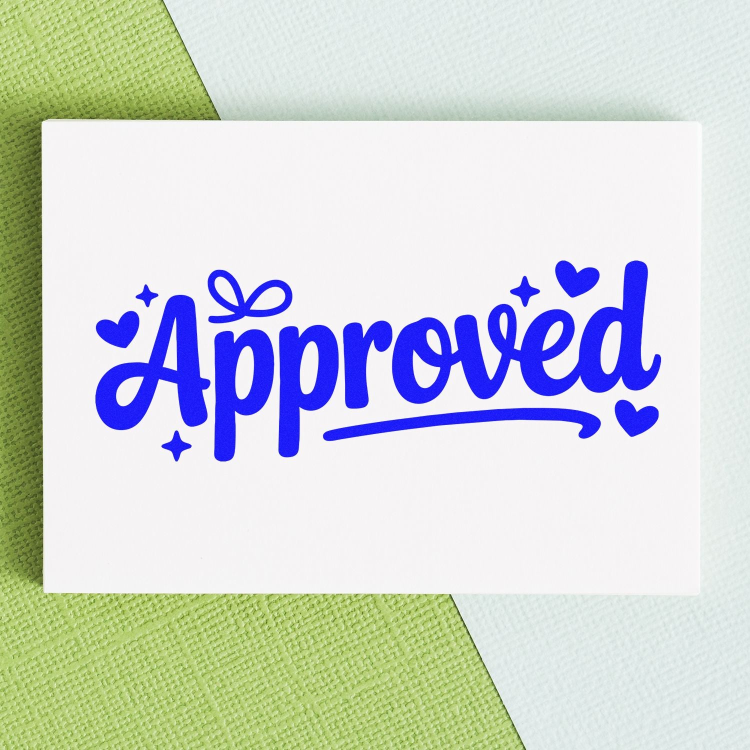 Blue Approved stamp seal with hearts and sparkles on a white card over a green textured background.