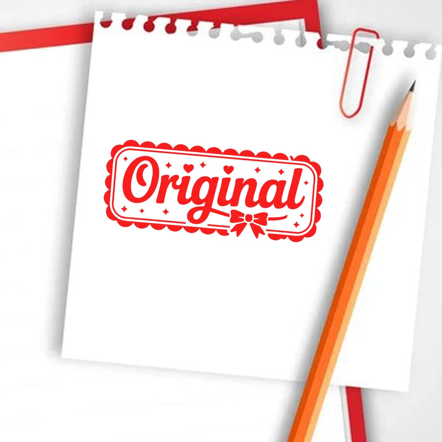 Red Original stamp seal on white notepad with scalloped border, red paperclip, and orange pencil.