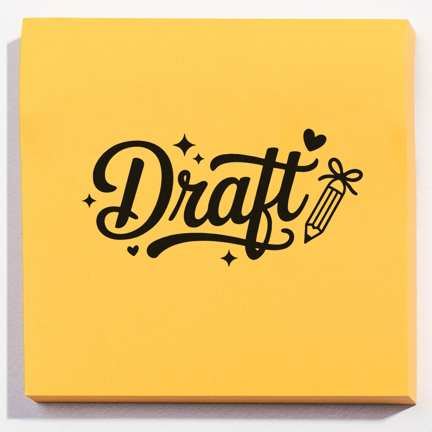 Yellow stamp and seal pad with bold black Draft lettering, pencil icon, hearts, and sparkles.