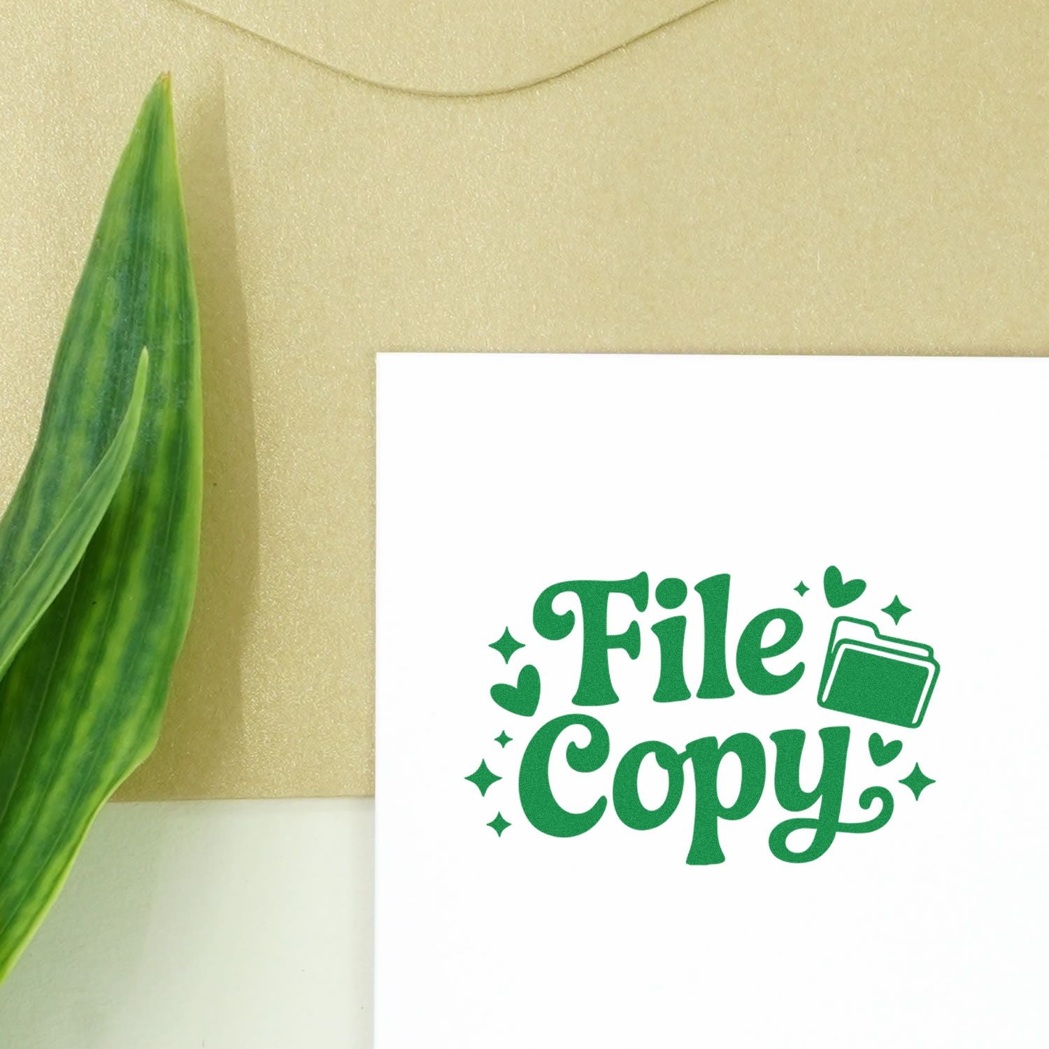Green File Copy stamp and seal design with folder icon on white card, beside a green leaf.