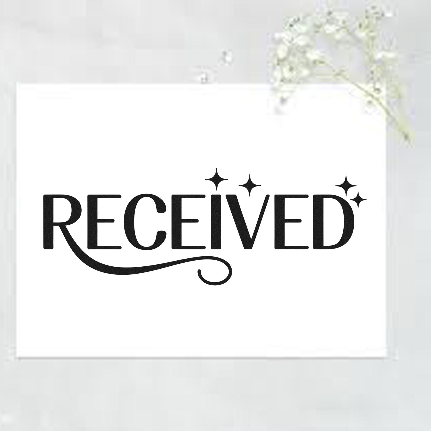 Black RECEIVED stamp with sparkles on a white seal card, minimalist stamp and seal product.