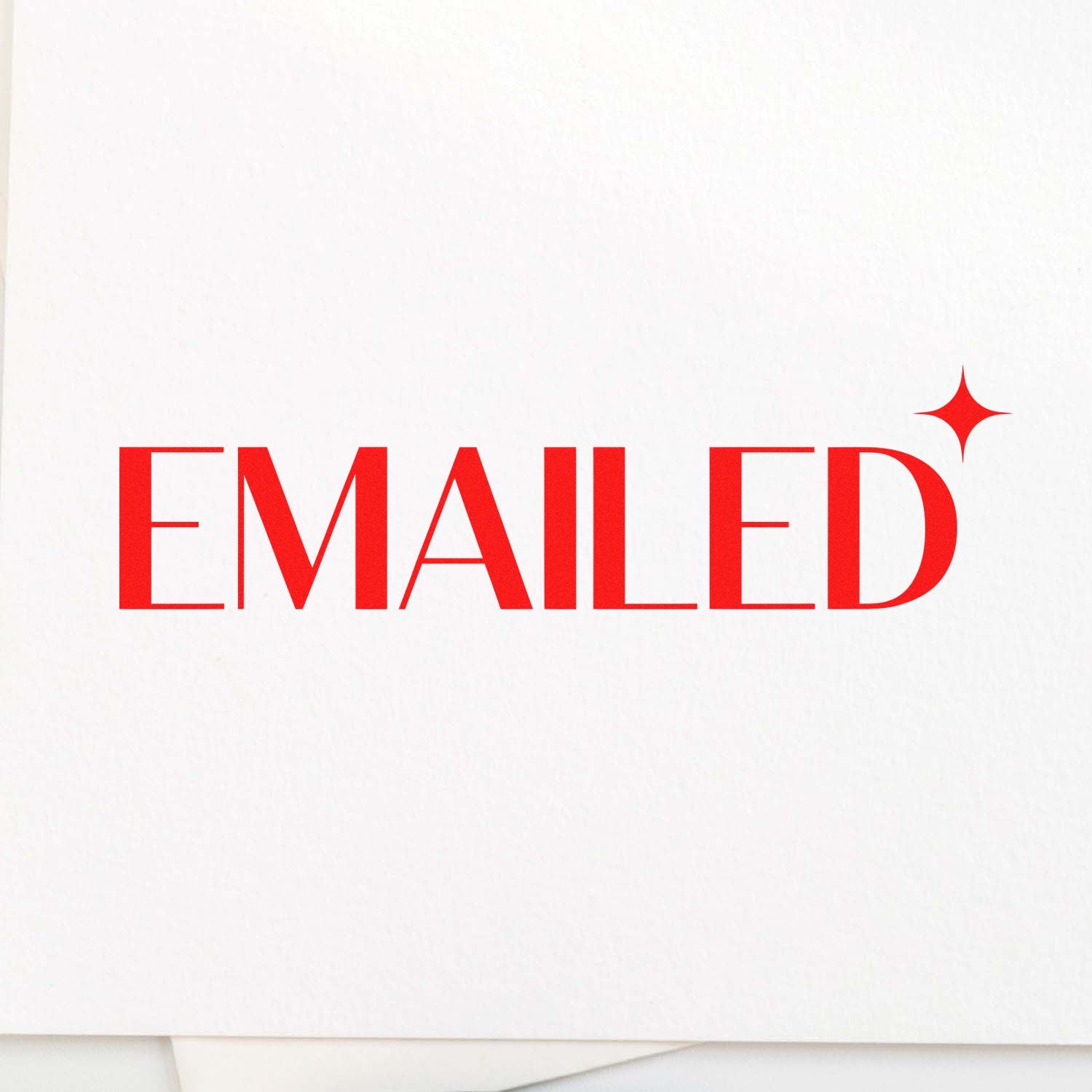 Red EMAILED stamp seal with sparkle icon on white paper, marking a processed document.