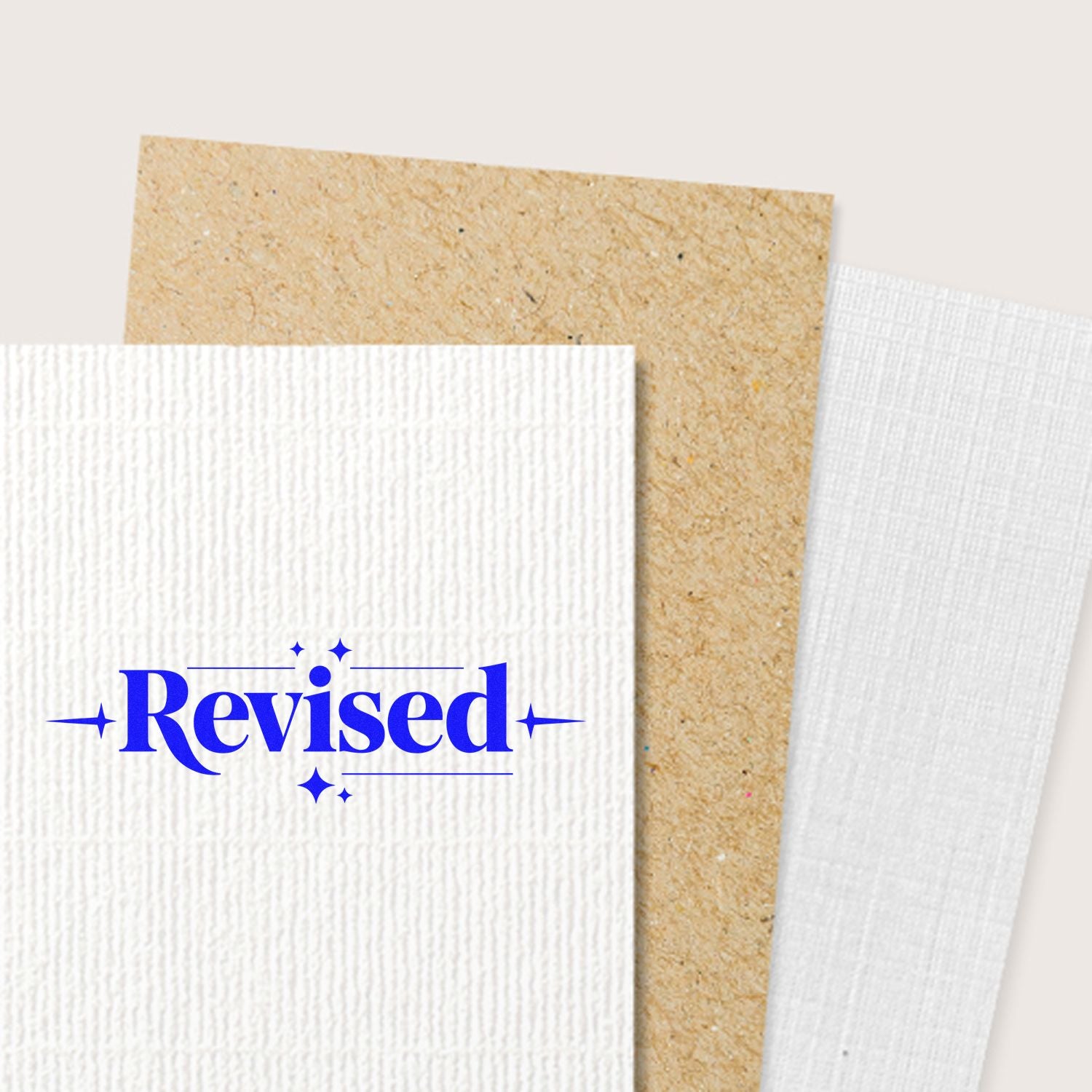 Textured stamp and seal swatches on white and kraft paper, featuring a blue Revised approval stamp.